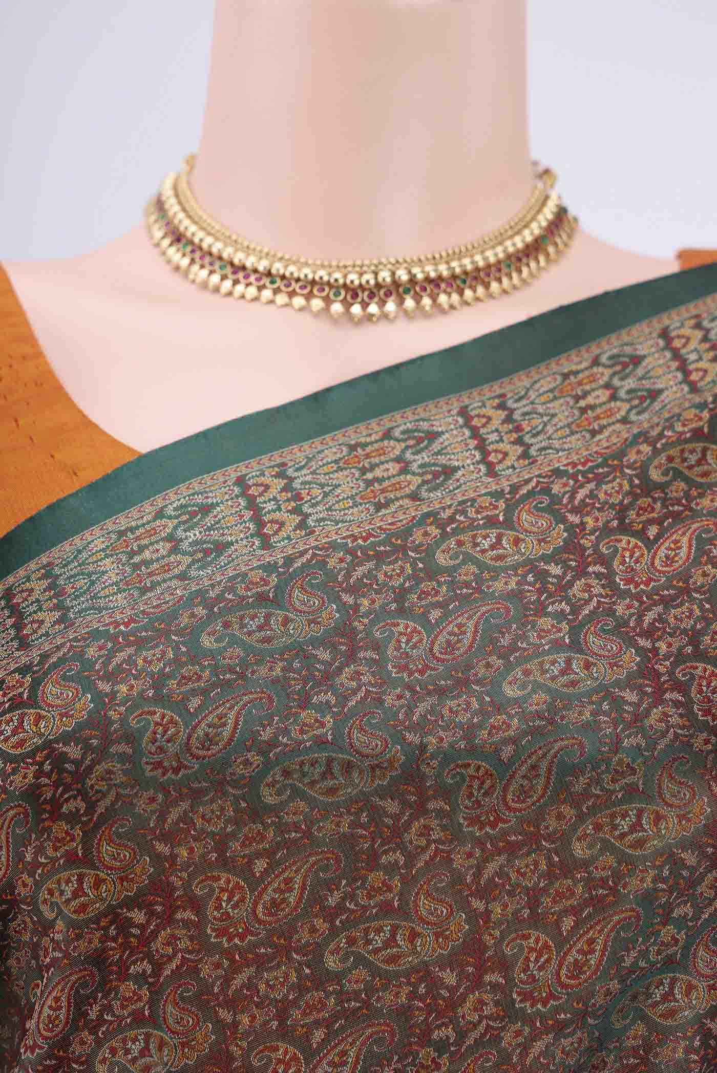 Border image of Bottle Green Banarasi Tanchoi Silk Saree with Thread Brocade on the body and Thread Border. 