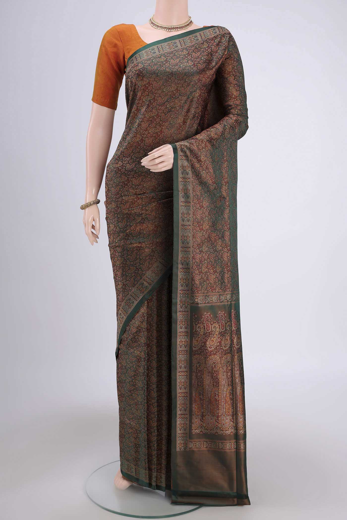 Bottle Green Banarasi Tanchoi Silk Saree with Thread Brocade on the body and Thread Border.  displayed on a mannequin