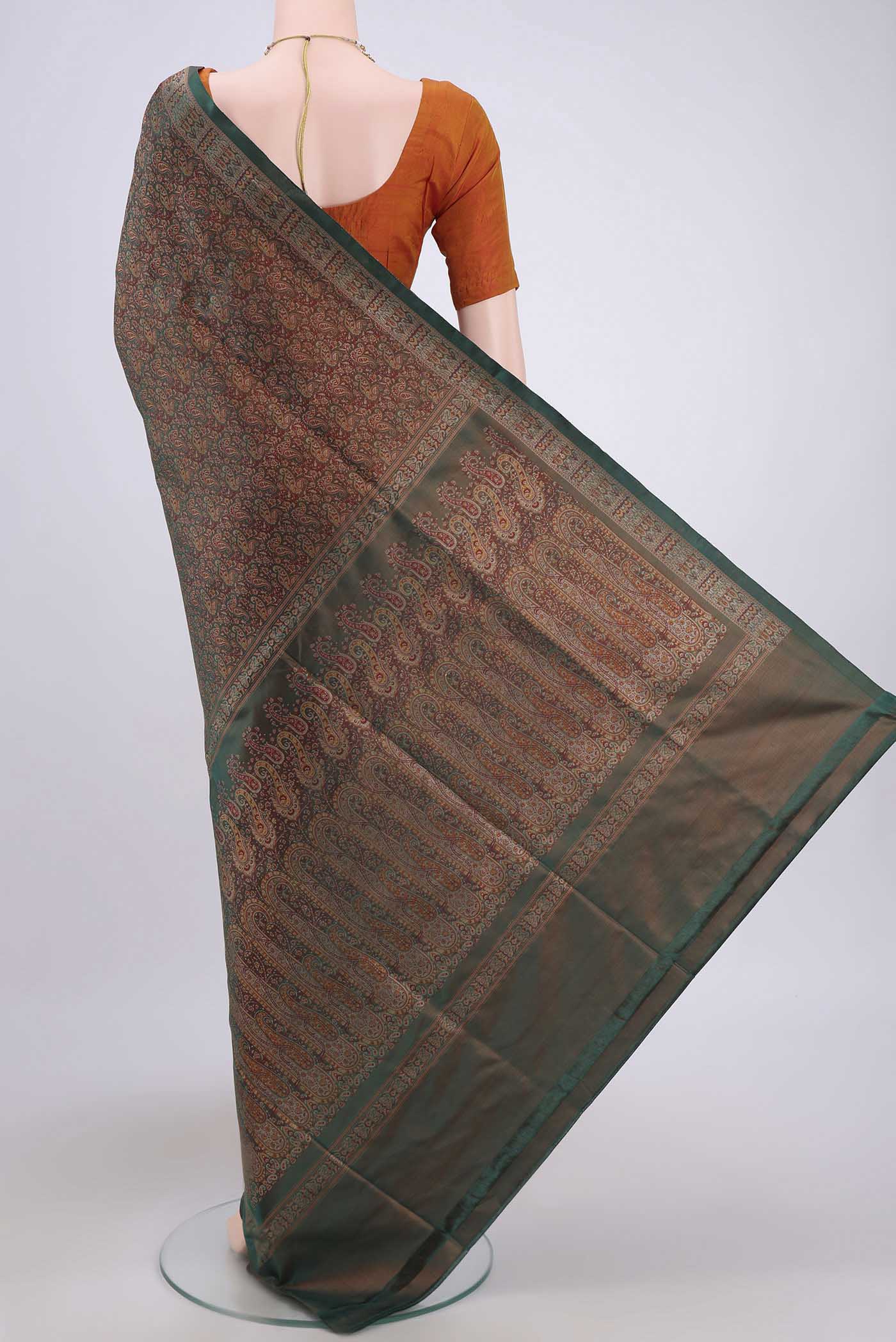 Flat view of Bottle Green Banarasi Tanchoi Silk Saree with Thread Brocade on the body and Thread Border. 