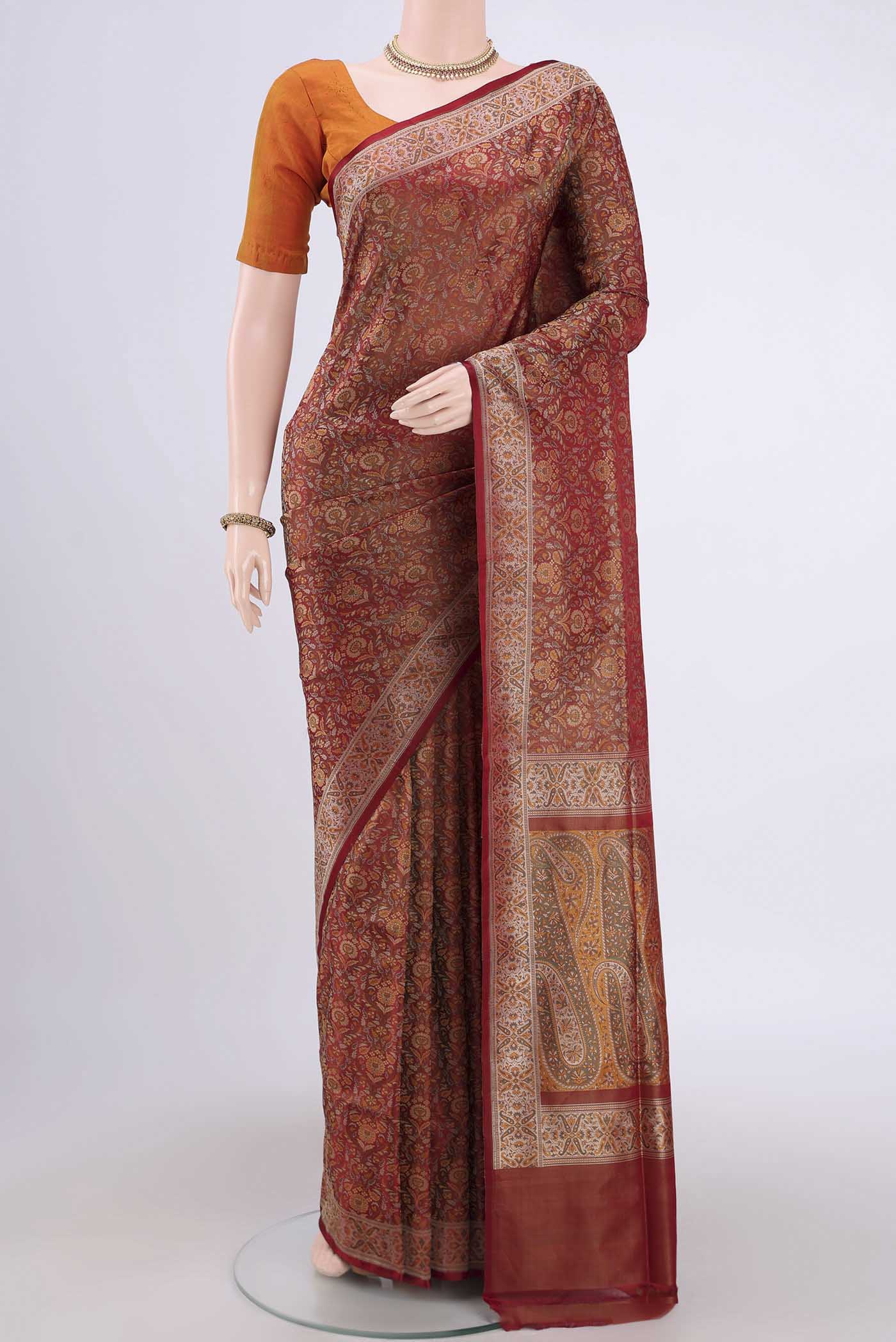 Maroon Banarasi Tanchoi Silk Saree with Thread Brocade on the body and Thread Border.  displayed on a mannequin