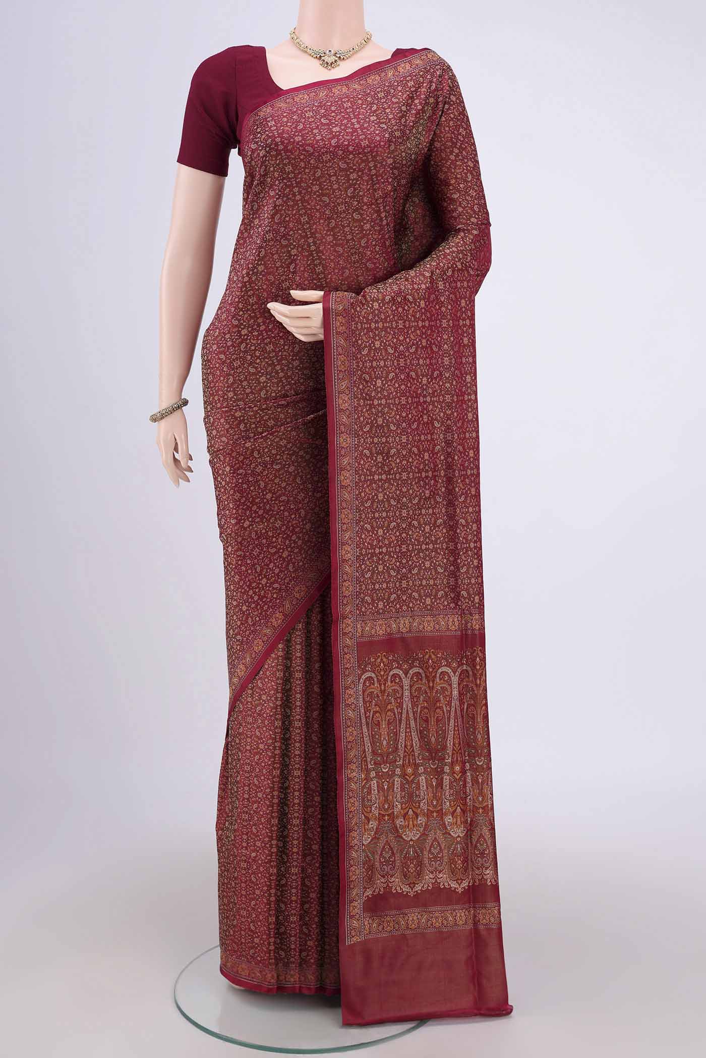 Maroon Banarasi Tanchoi Silk Saree with Thread Brocade on the body and Thread Border.  displayed on a mannequin