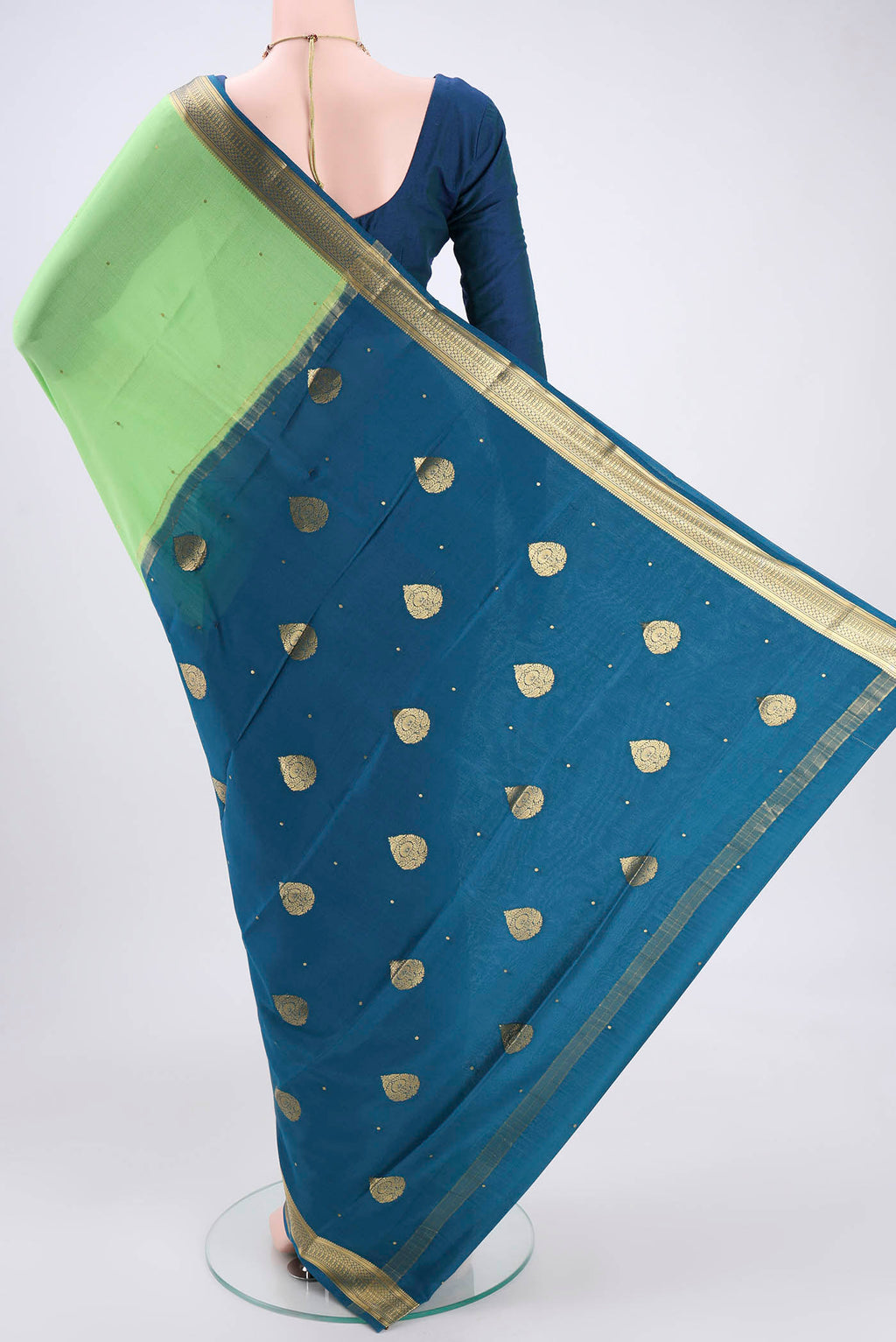 Flat view of Parrot Green Mysore Crepe Saree with Plain Body and Zari Border. 