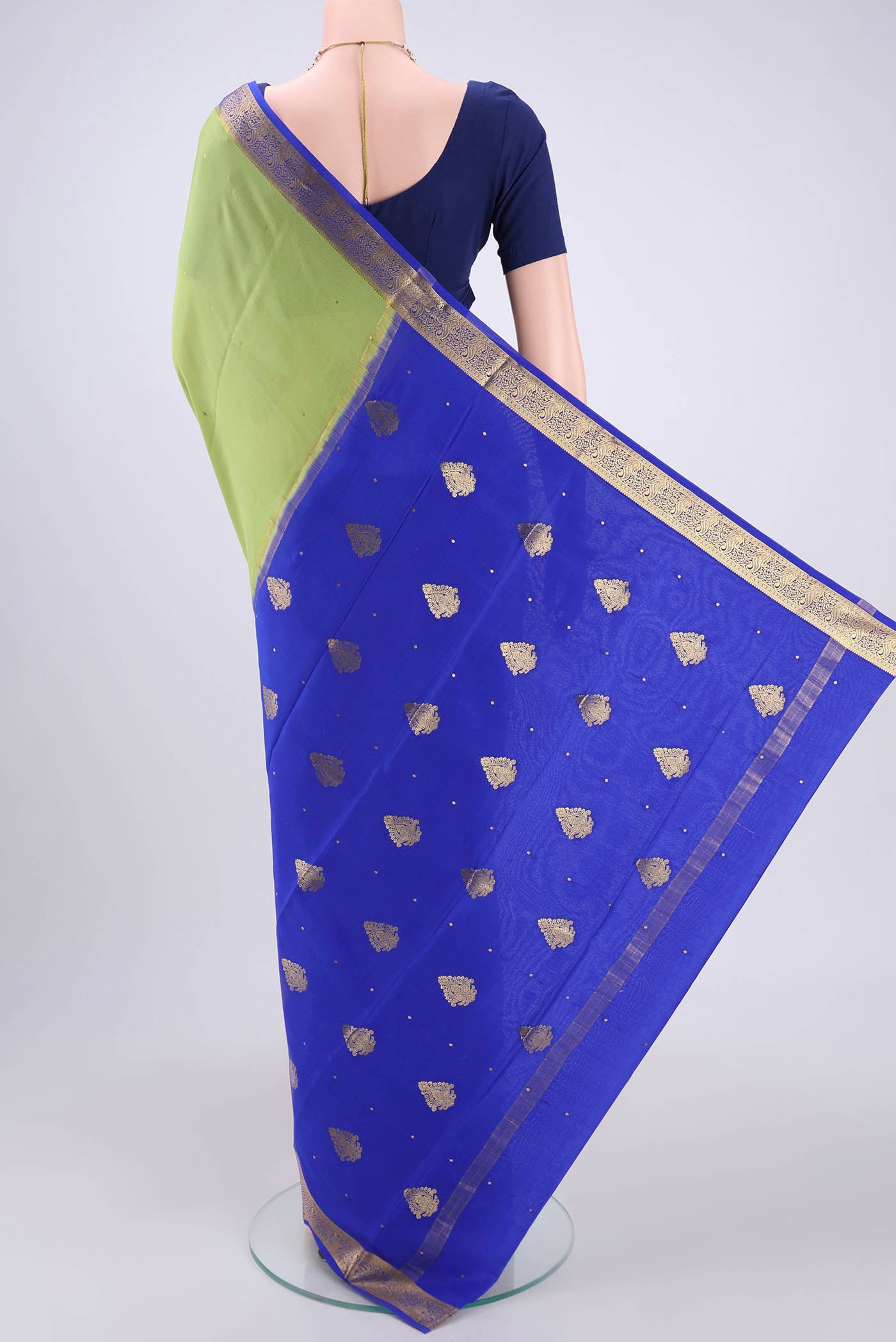 Flat view of Green Mysore Crepe Saree with Plain Body and Zari Border. 