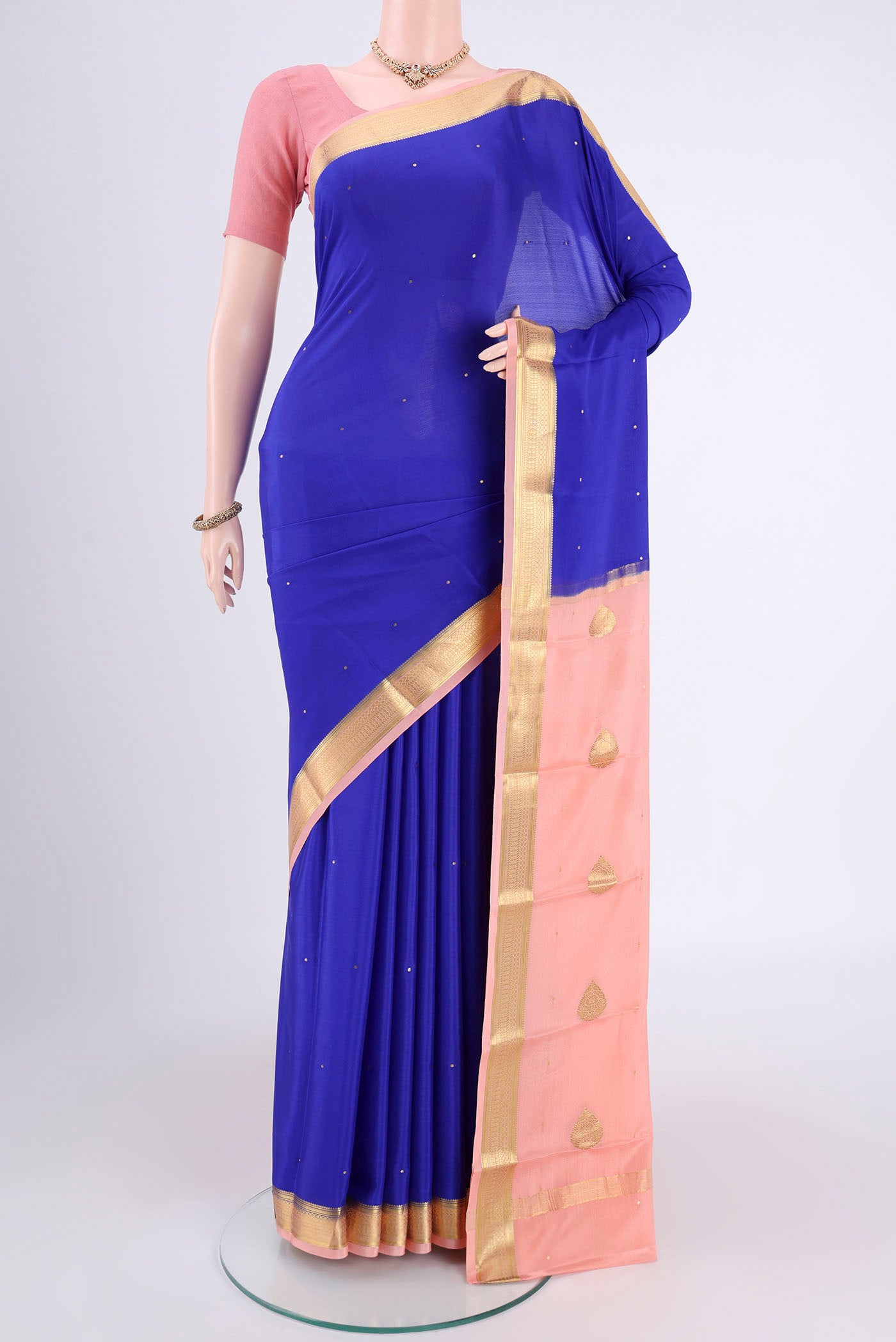 Royal Blue Mysore Crepe Saree with Zari Butta on the body and Zari Border.  displayed on a mannequin