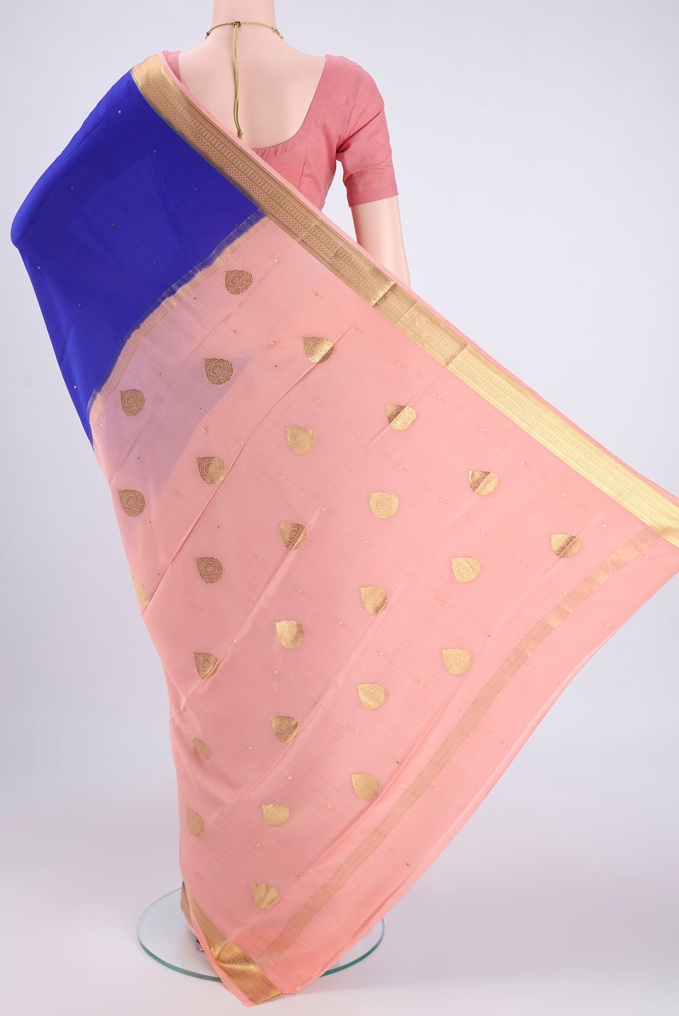 Flat view of Royal Blue Mysore Crepe Saree with Zari Butta on the body and Zari Border. 