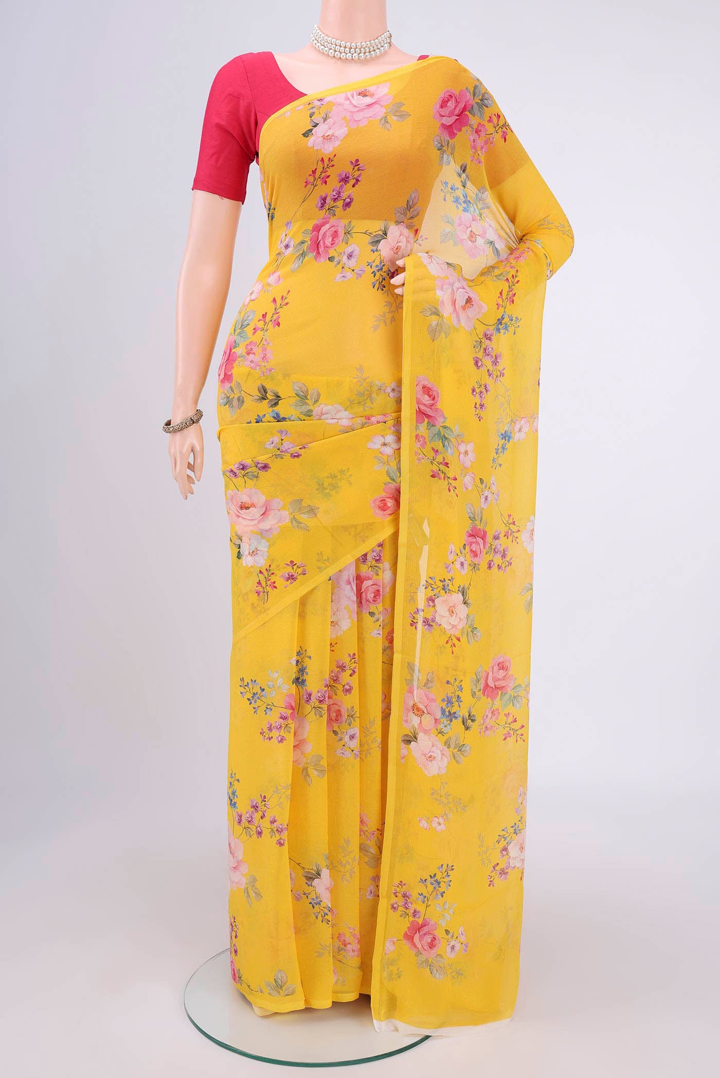 Yellow Mysore Chiffon Saree with Floral Print on the body and Without Border.  displayed on a mannequin