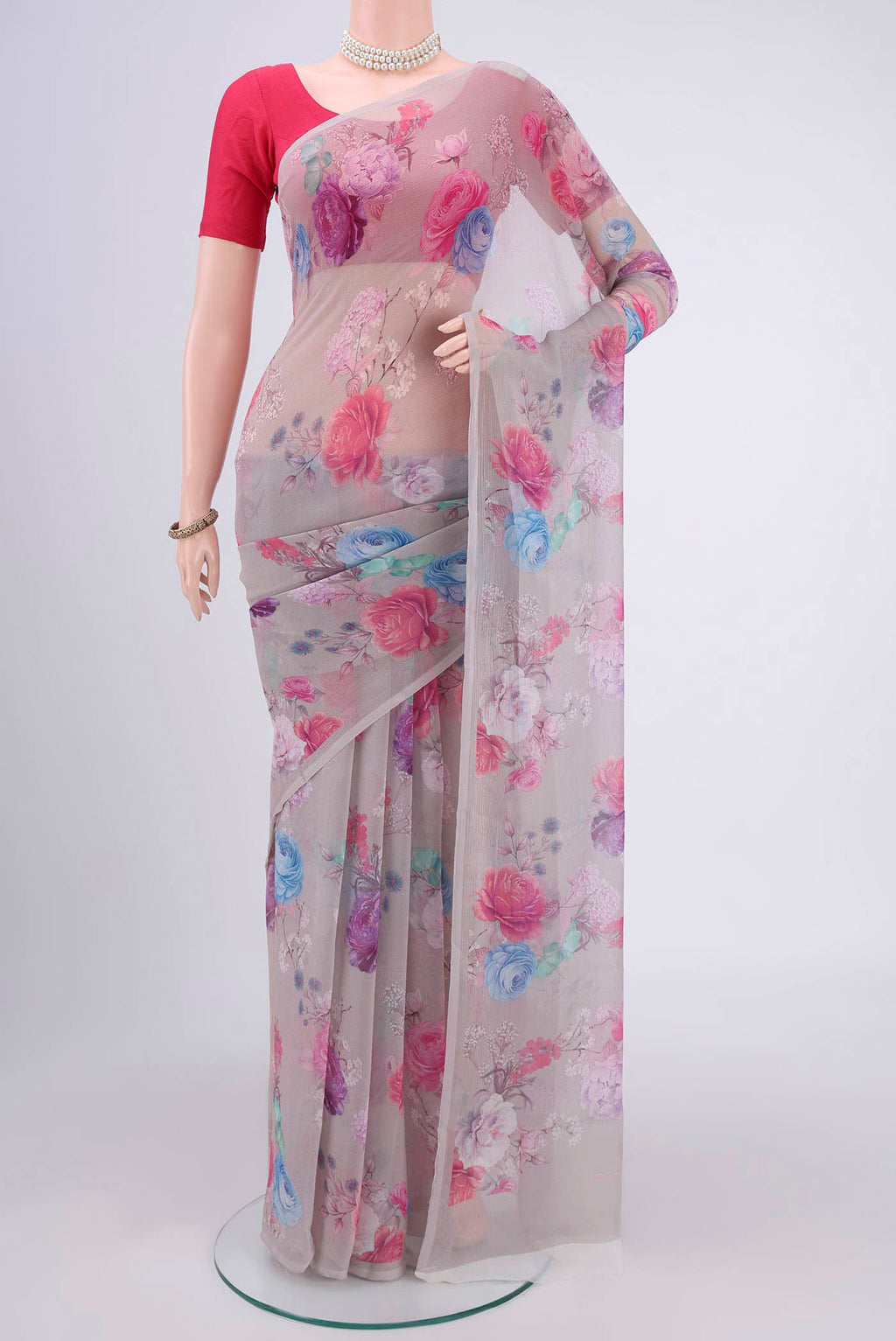 White Mysore Chiffon Saree with Floral Print on the body and Without Border.  displayed on a mannequin