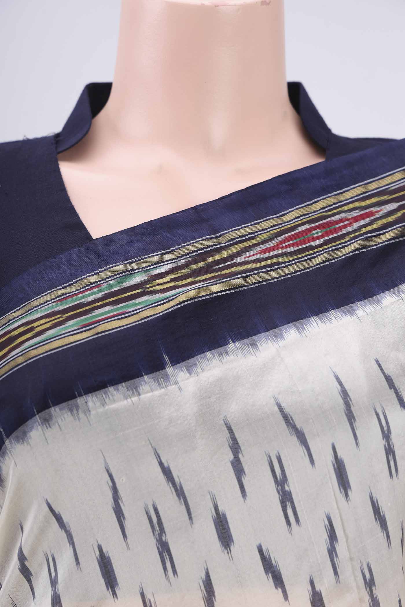 Border image of Off White Pochampally Silk Saree with Ikat design on the body and Ikat Border. 