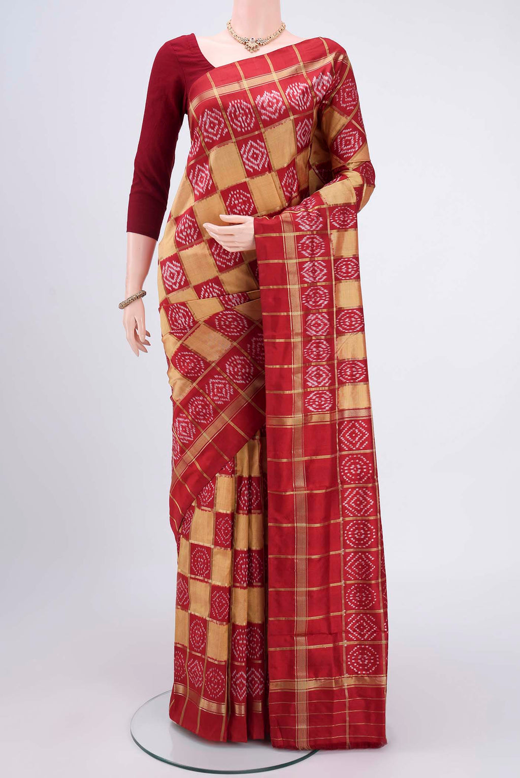 Dark Beige Pochampally Silk Saree with Checked design on the body and Zari Border.  displayed on a mannequin