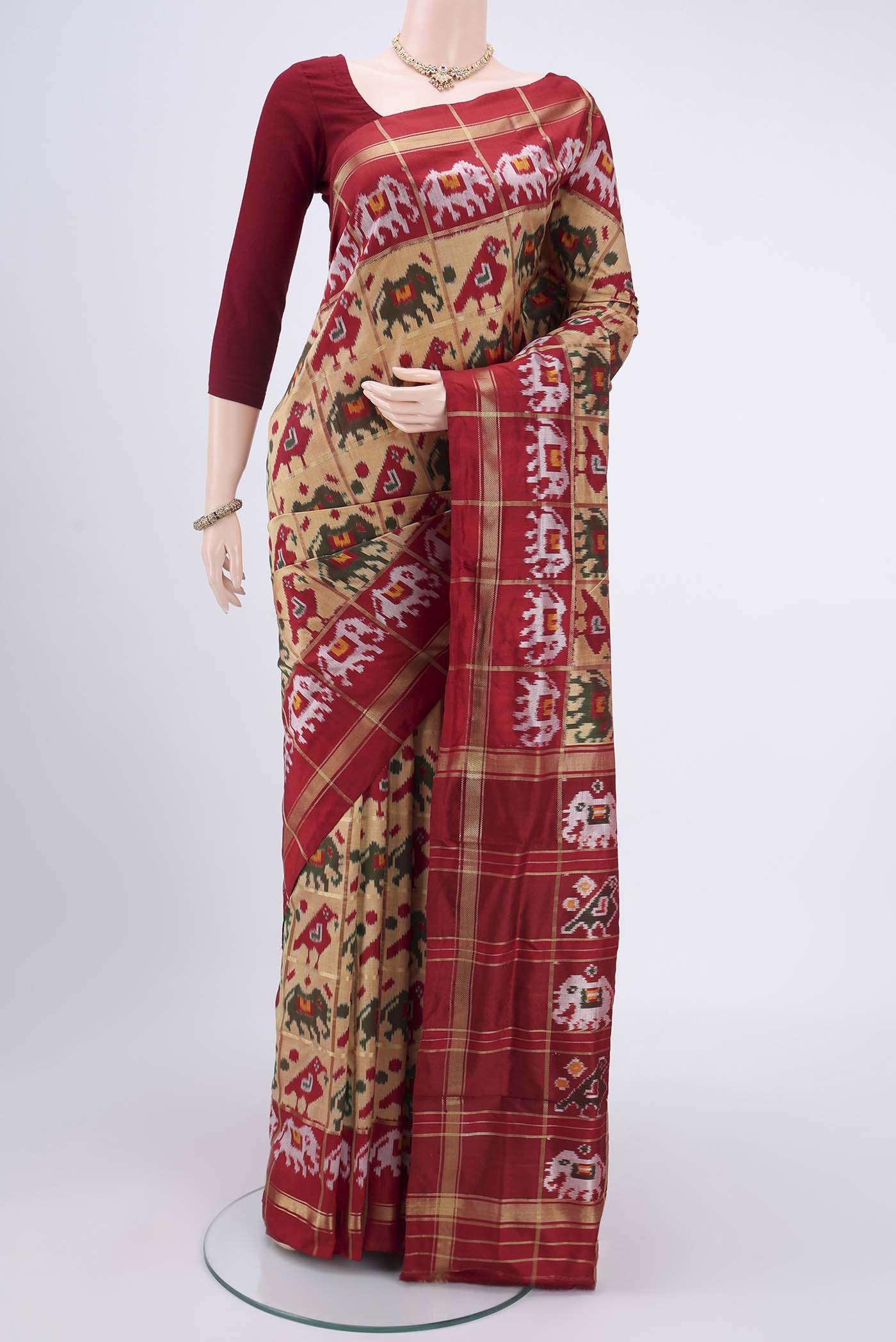 Dark Beige Pochampally Silk Saree with Checked design on the body and Zari Border.  displayed on a mannequin