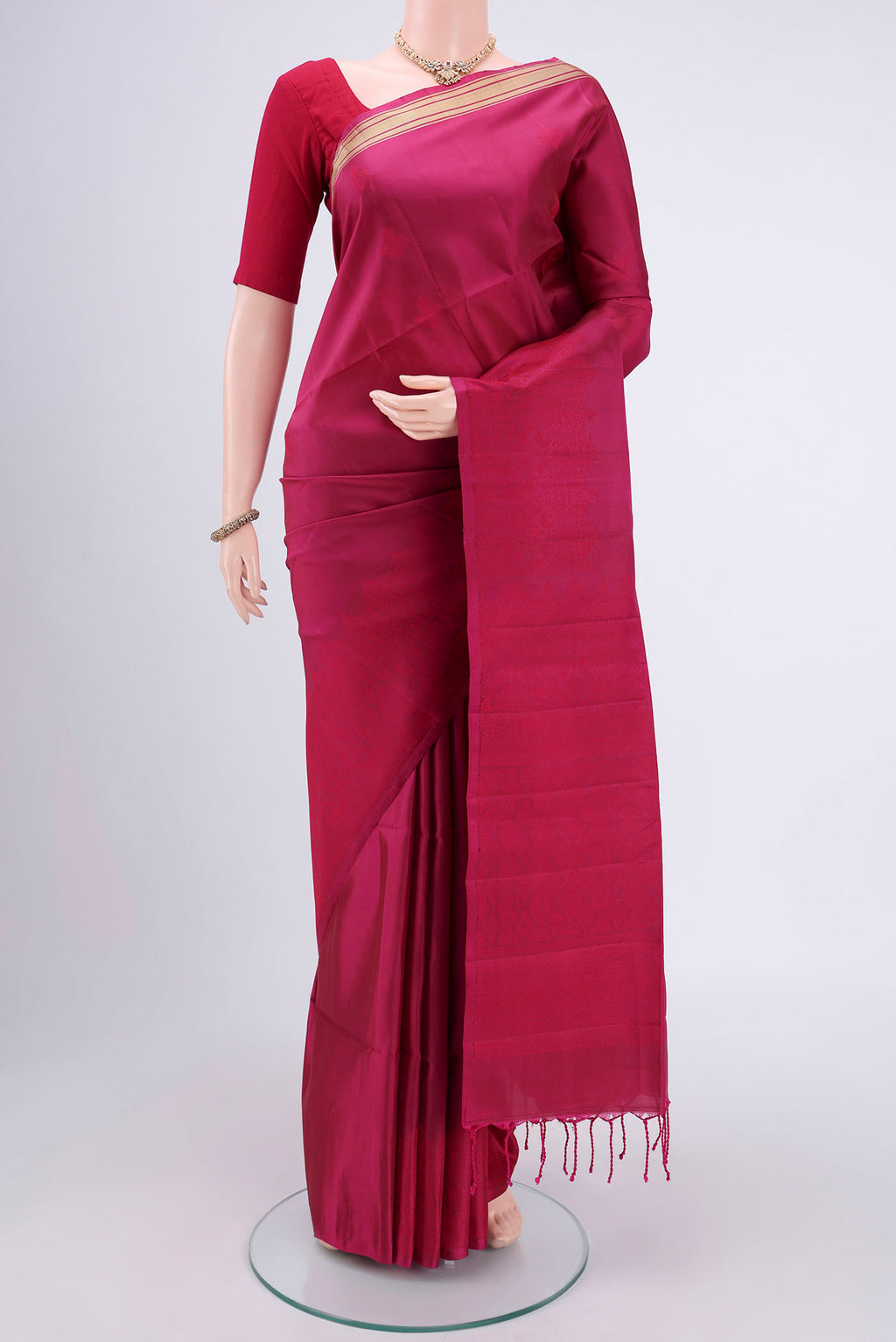 Rani Pink Bangalore Silk Saree with Thread Butta on the body and Thread Border.  displayed on a mannequin