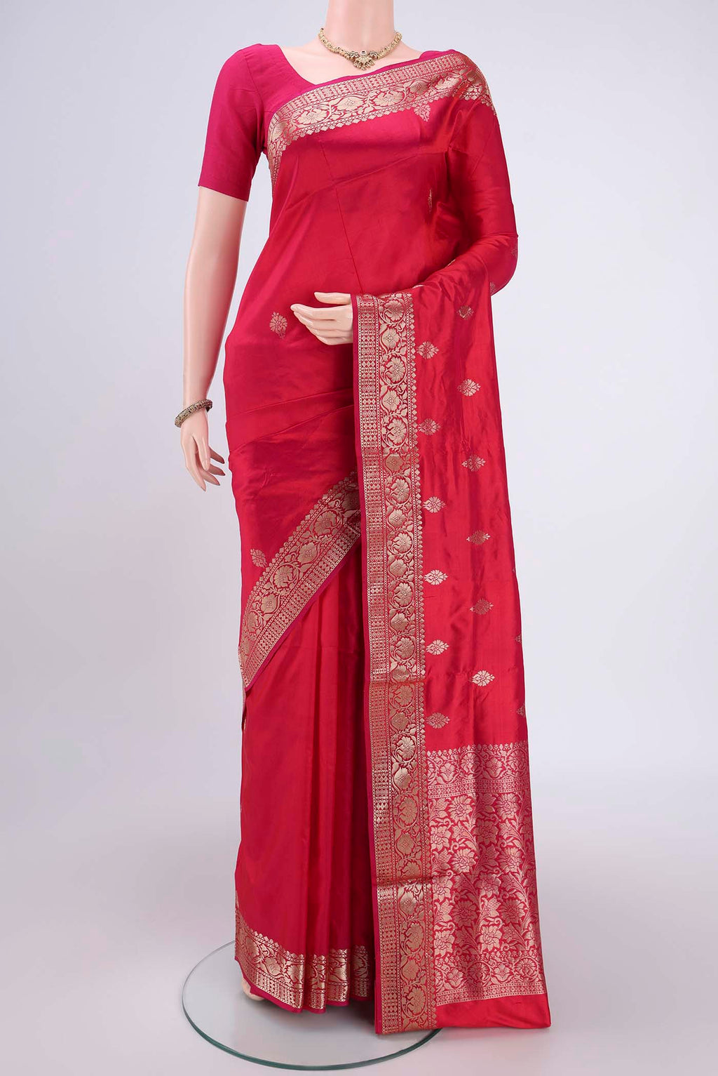 Imperial Pink Banarasi Katan Silk Saree with Zari Butta on the body and Zari Border.  displayed on a mannequin