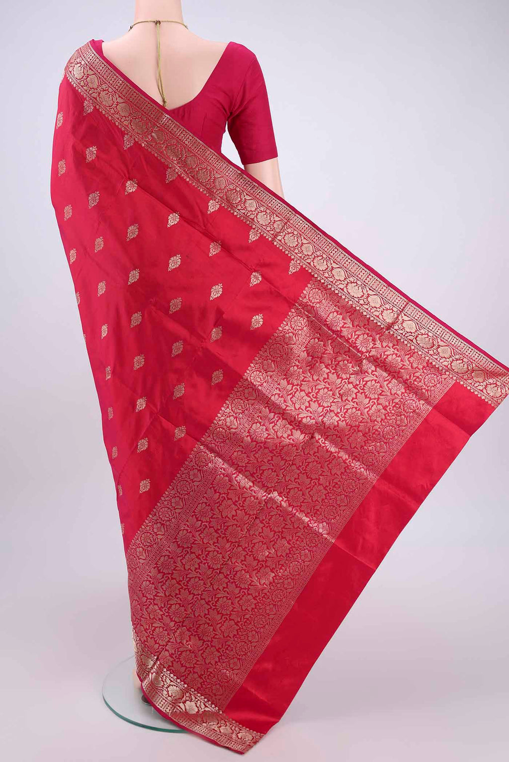 Flat view of Imperial Pink Banarasi Katan Silk Saree with Zari Butta on the body and Zari Border. 