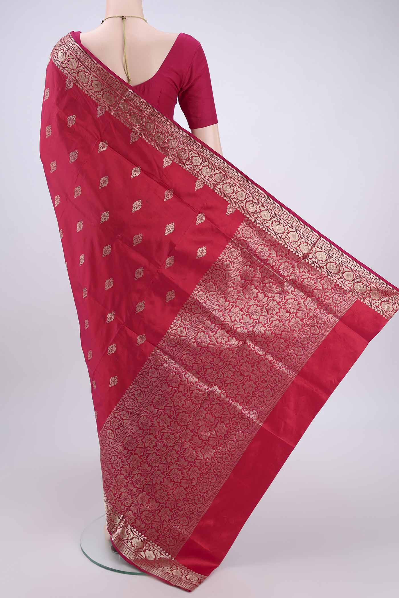 Flat view of Imperial Pink Banarasi Katan Silk Saree with Zari Butta on the body and Zari Border. 