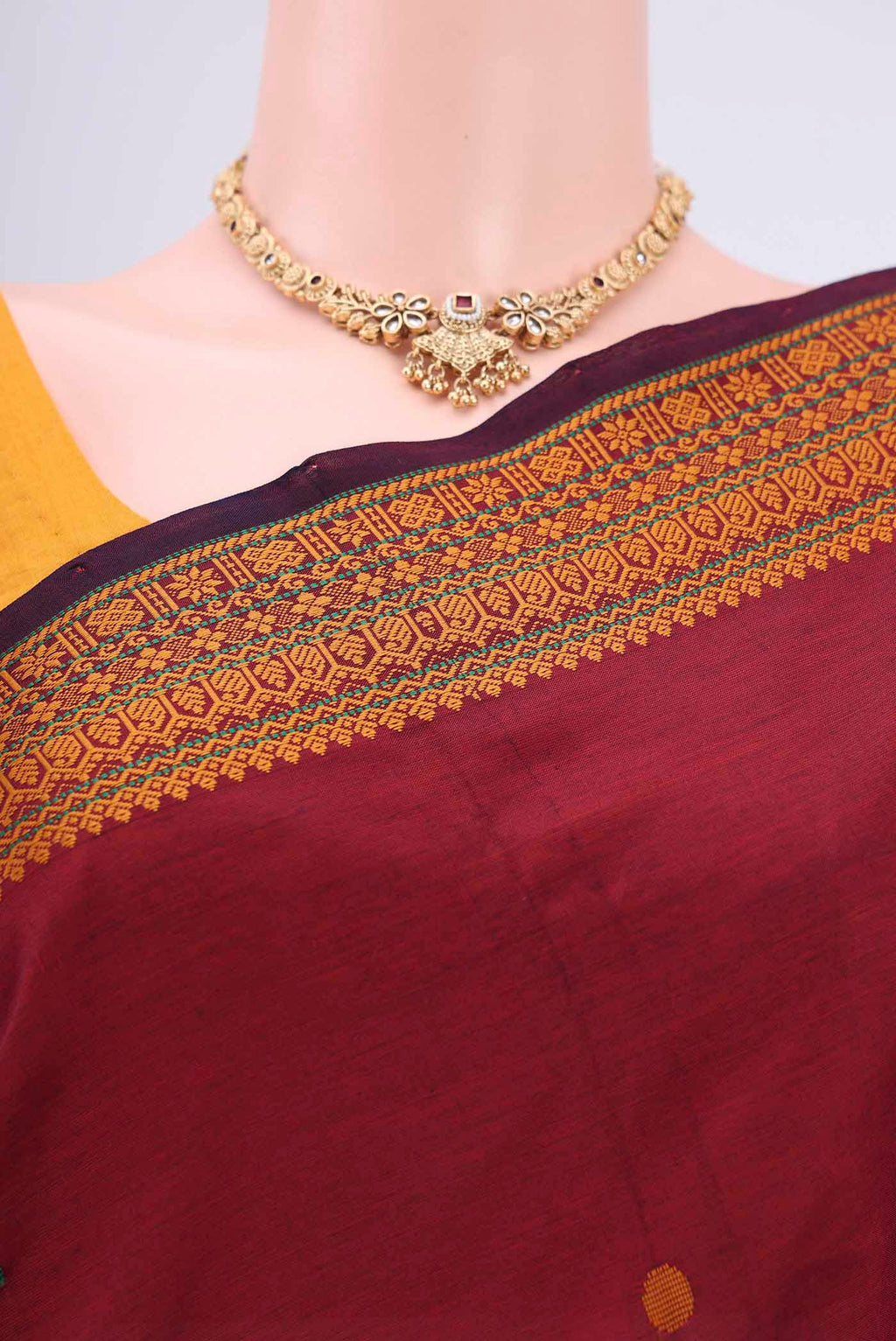 Border image of Maroon Blended Poly Cotton Saree with Thread Butta on the body and Thread Border. 