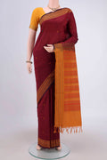 Maroon Blended Poly Cotton Saree with Thread Butta on the body and Thread Border.  displayed on a mannequin