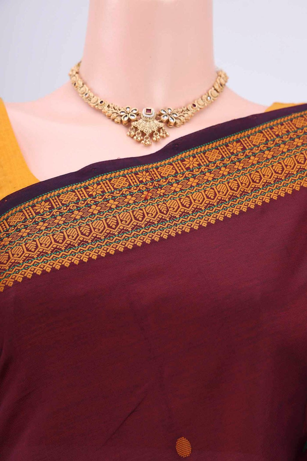 Border image of Maroon Blended Poly Cotton Saree with Thread Butta on the body and Thread Border. 