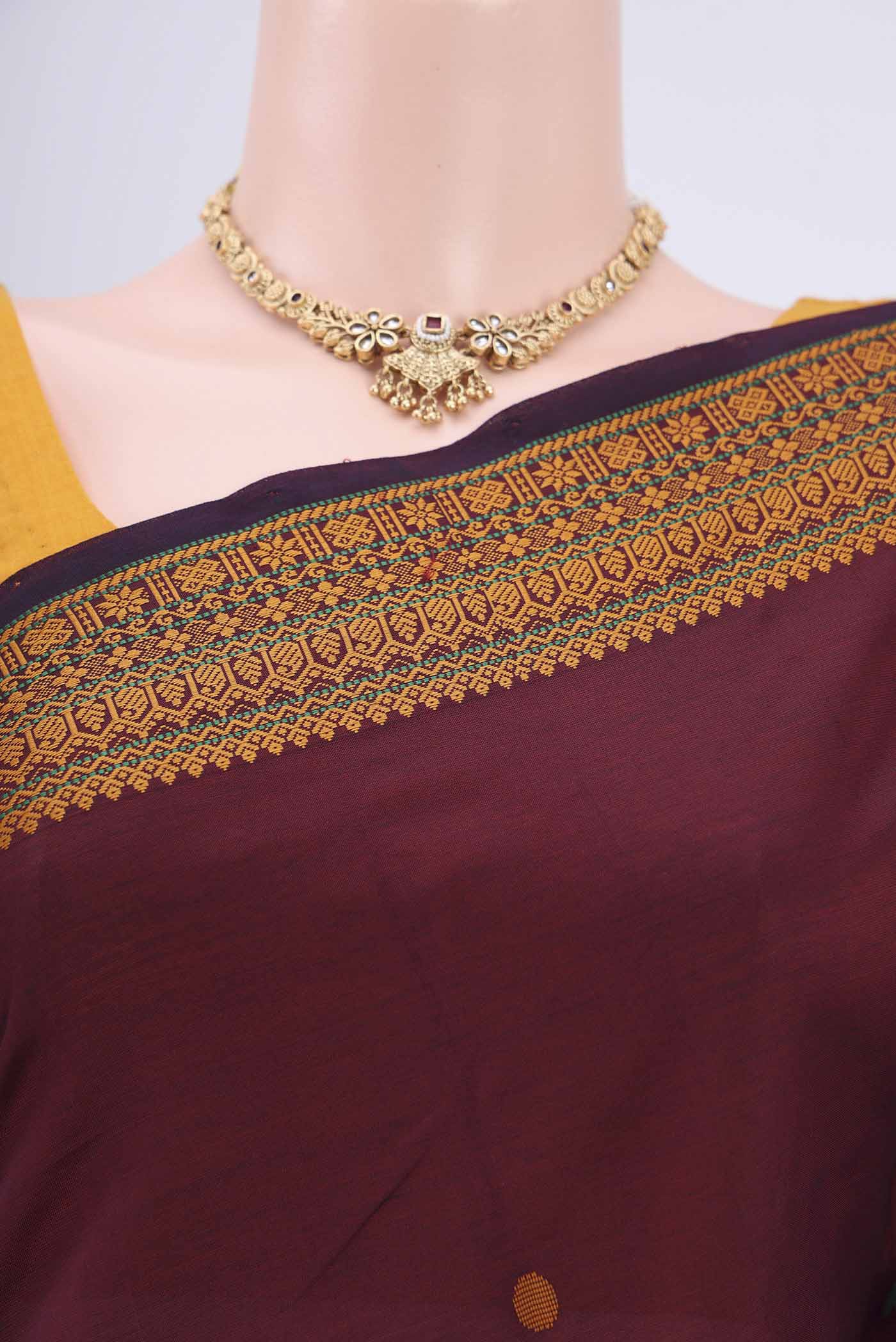 Border image of Maroon Blended Poly Cotton Saree with Thread Butta on the body and Thread Border. 