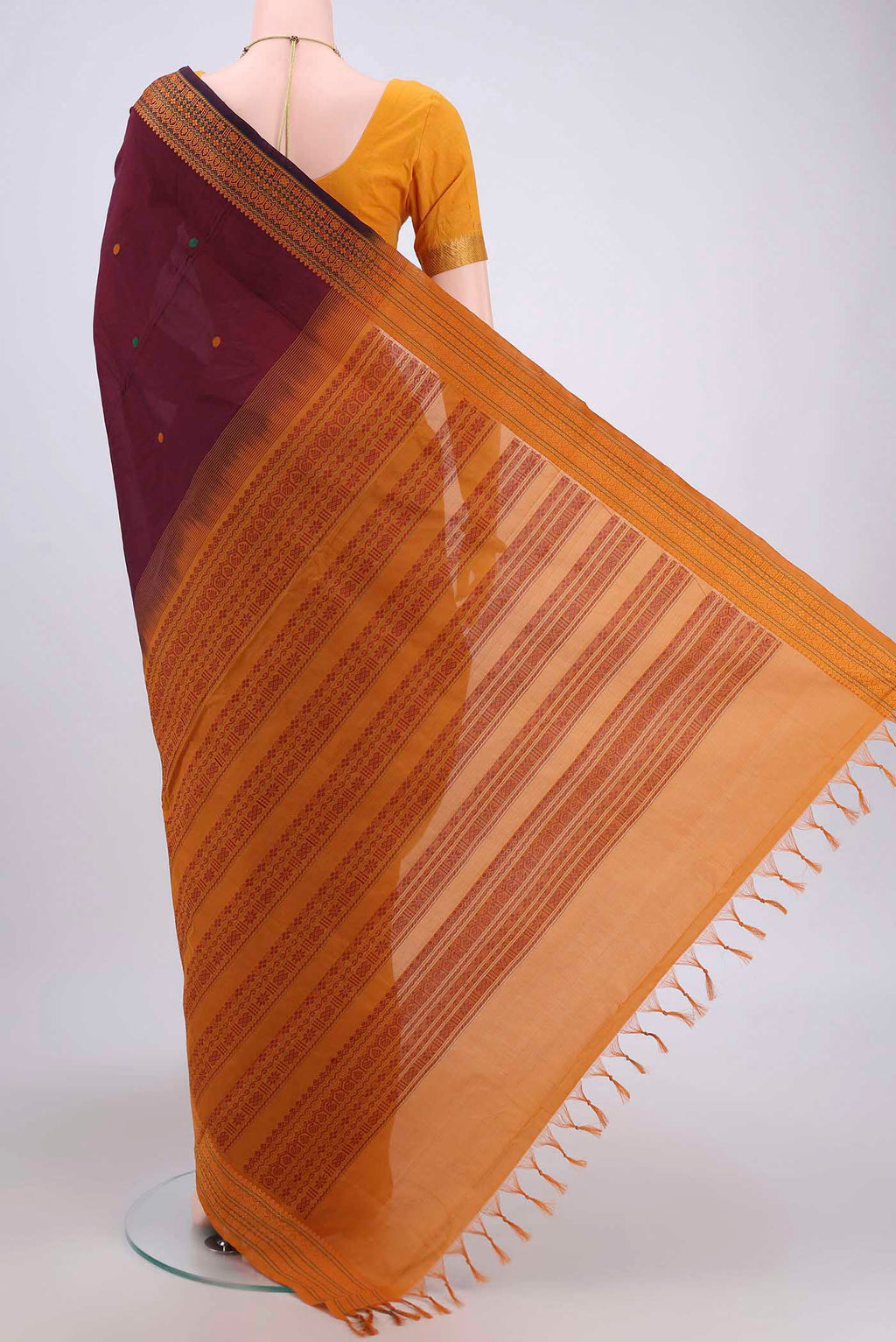 Flat view of Maroon Blended Poly Cotton Saree with Thread Butta on the body and Thread Border. 