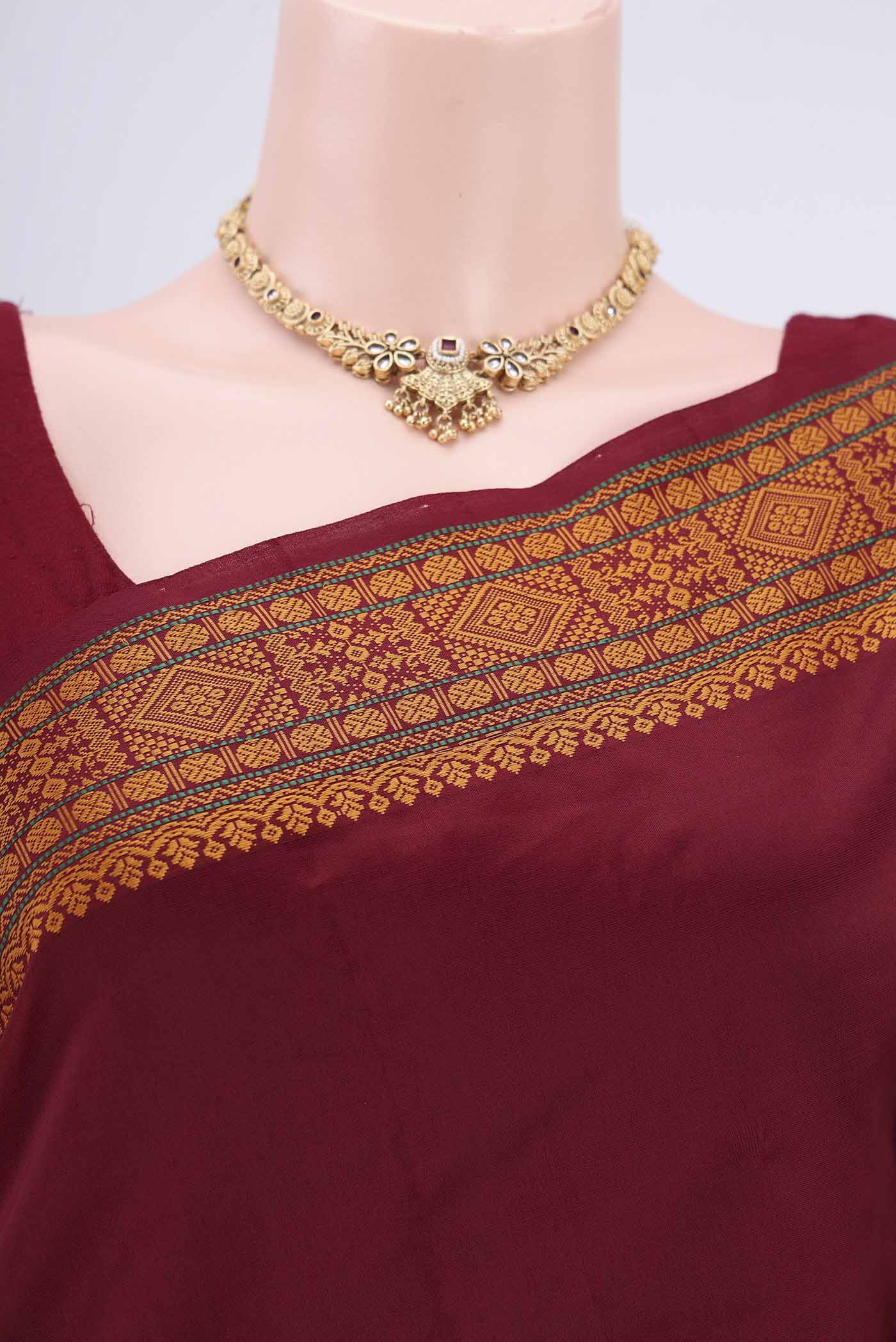 Border image of Maroon Blended Poly Cotton Saree with Thread Butta on the body and Thread Border. 