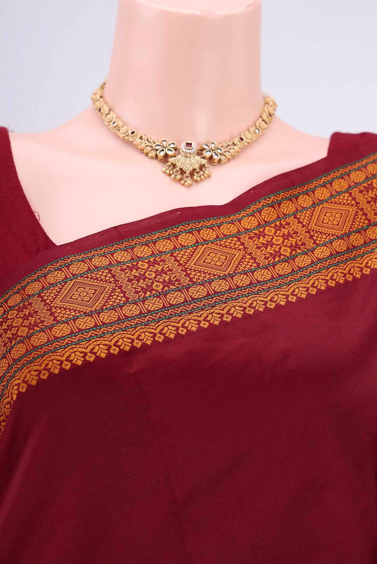 Border image of Maroon Blended Poly Cotton Saree with Thread Butta on the body and Thread Border. 