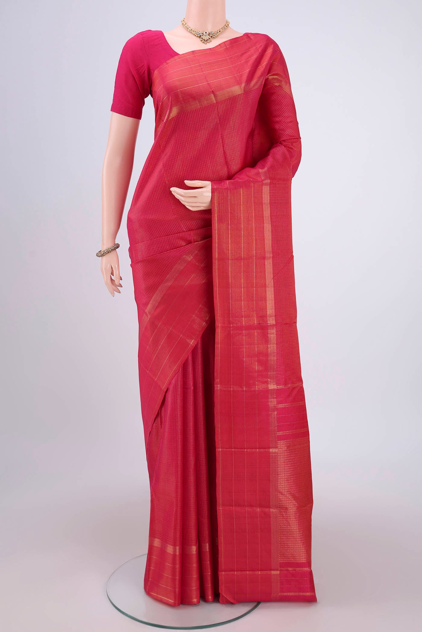 Dark Pink Dual Tone Kanchipuram Silk Saree with Checked design on the body and Zari Border.  displayed on a mannequin