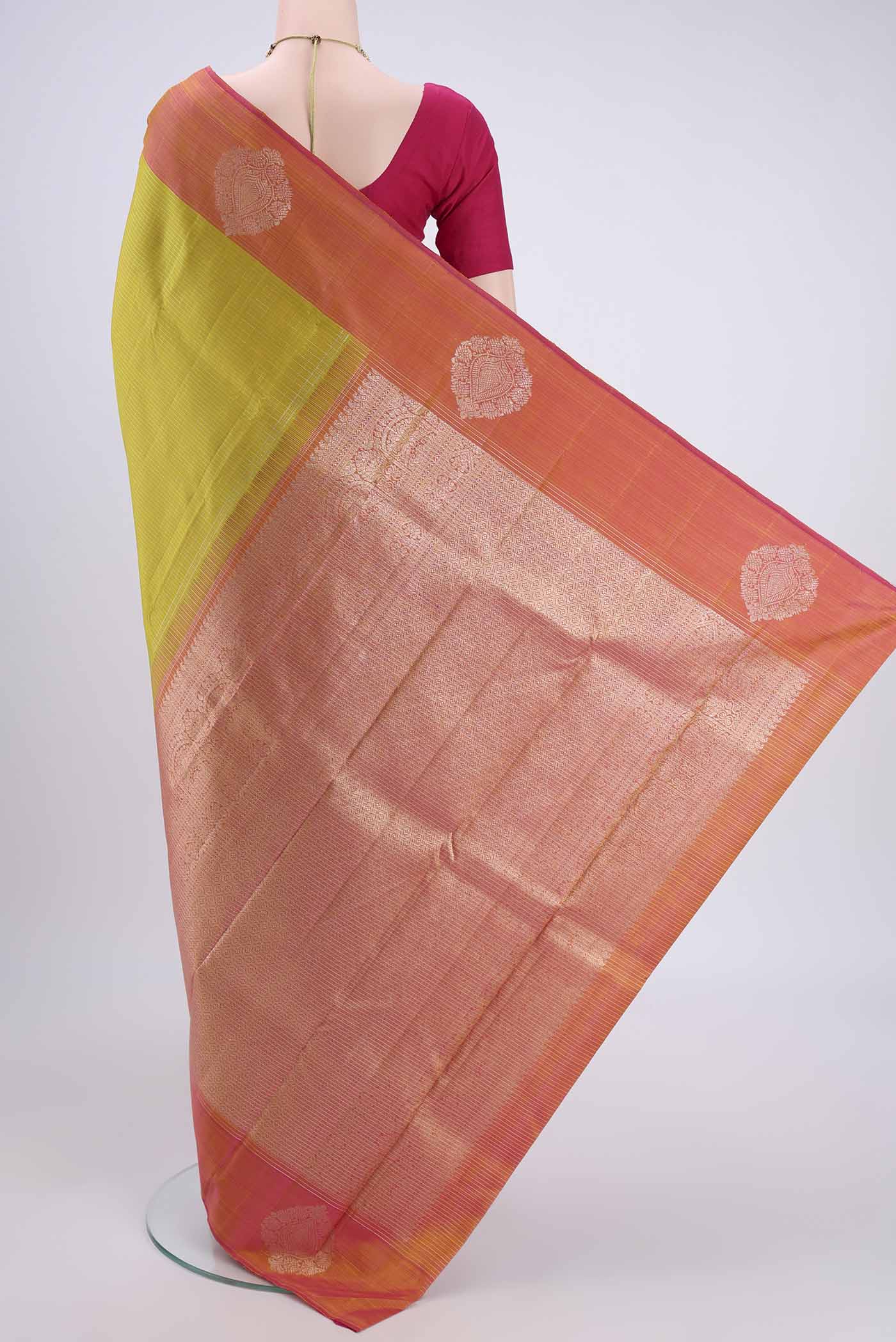 Flat view of Acid Green Kanjivaram Silk Saree with Checked design on the body and Zari Border. 