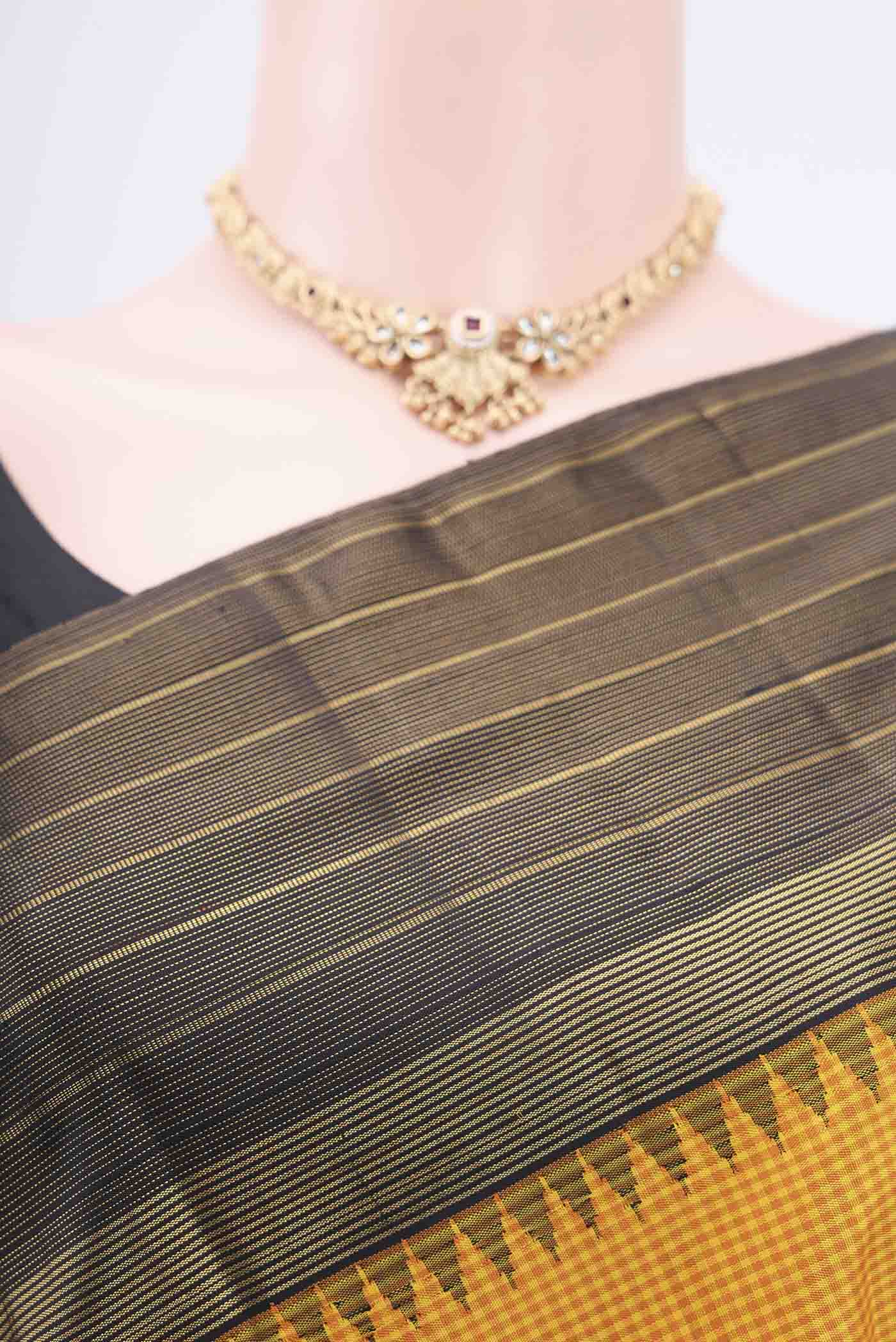 Border image of Yellow Kanjivaram Silk Saree with Checked design on the body and Zari Border. 