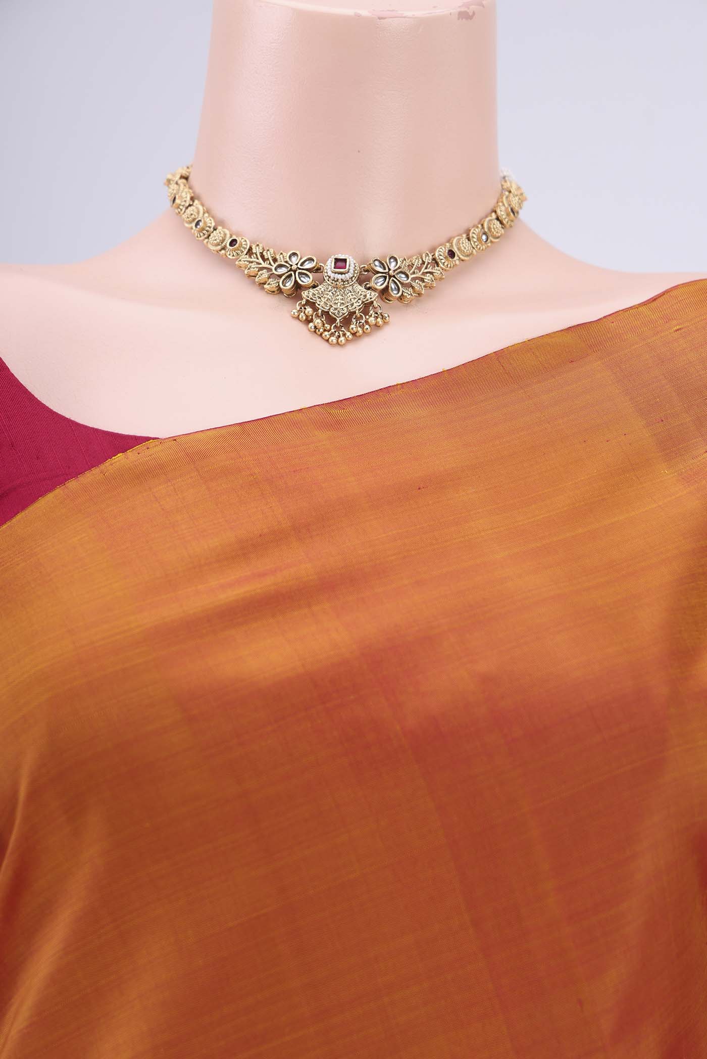 Border image of Mustard Kanchipuram Silk Saree with Plain Body and Rising Temple Border. 