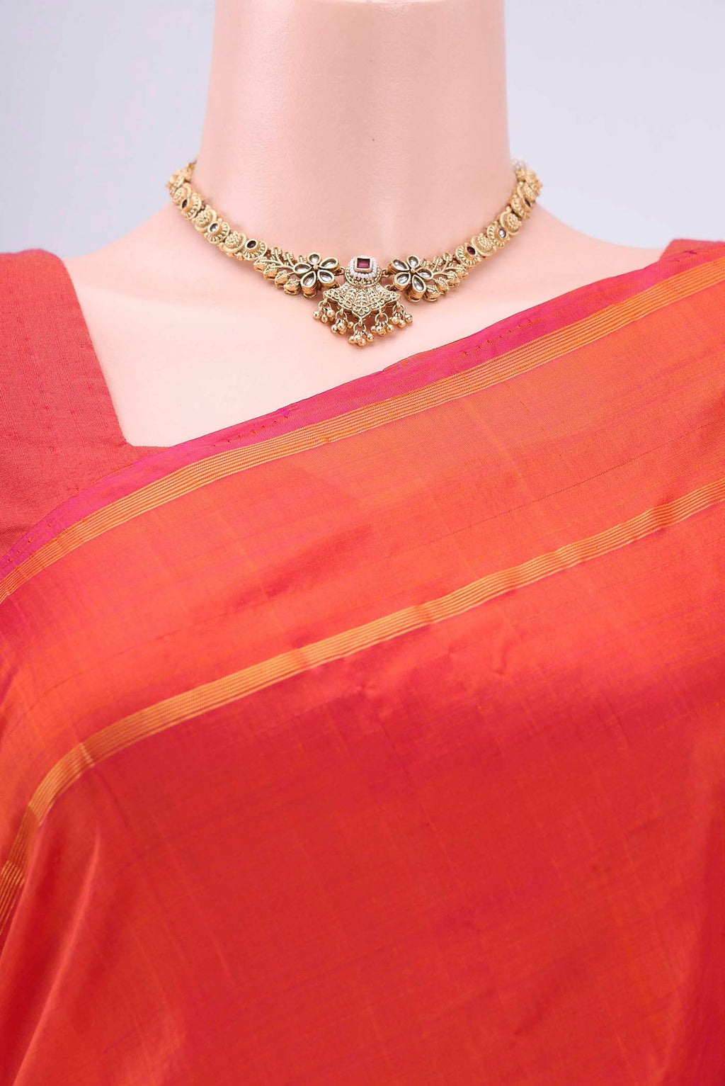 Border image of Brick Orange Kanchipuram Silk Saree with Plain Body and Zari And Thread Border. 