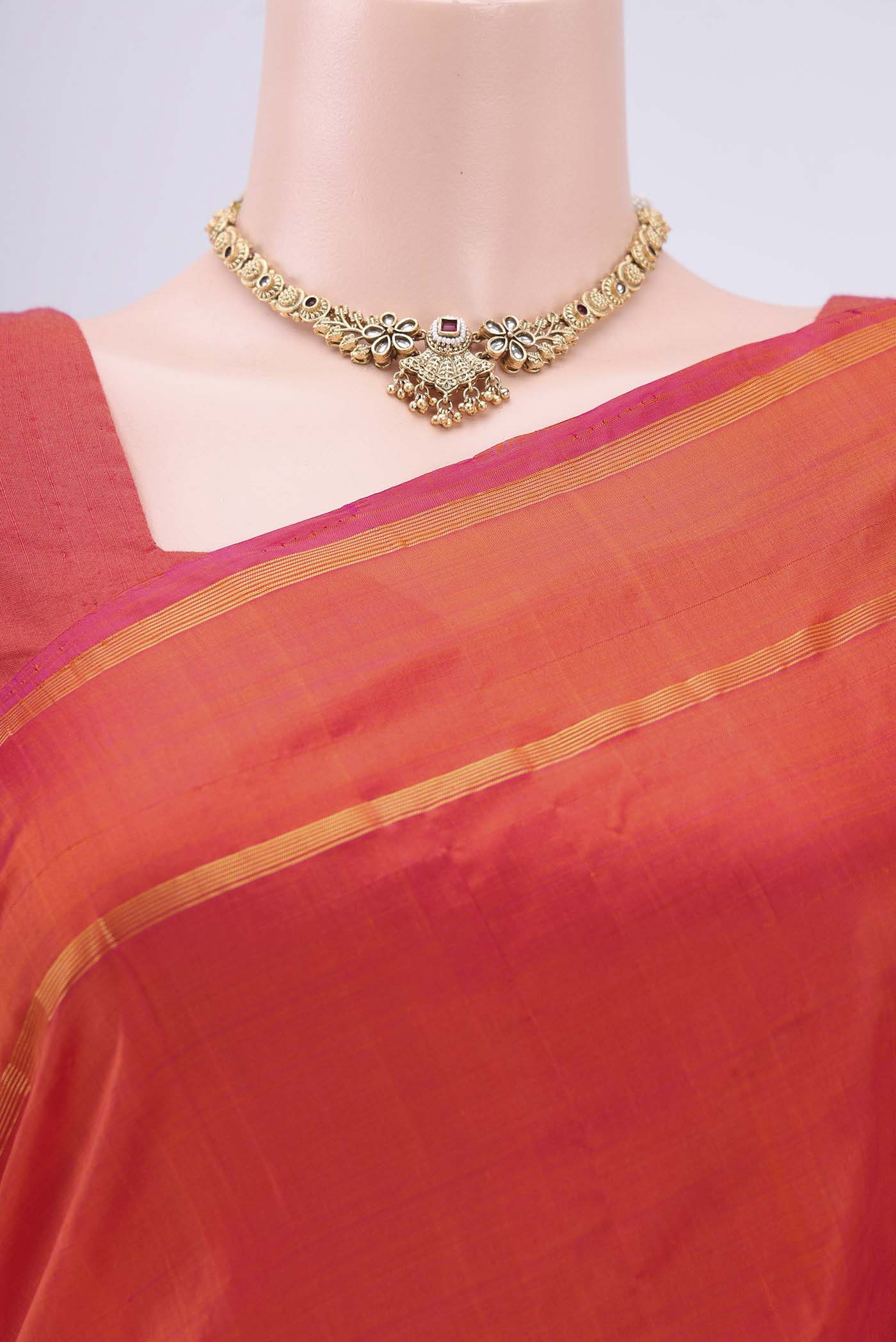 Border image of Brick Orange Kanchipuram Silk Saree with Plain Body and Zari And Thread Border. 
