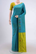 Sea Green Kanchipuram Silk Saree with Plain Body and Zari And Thread Border.  displayed on a mannequin