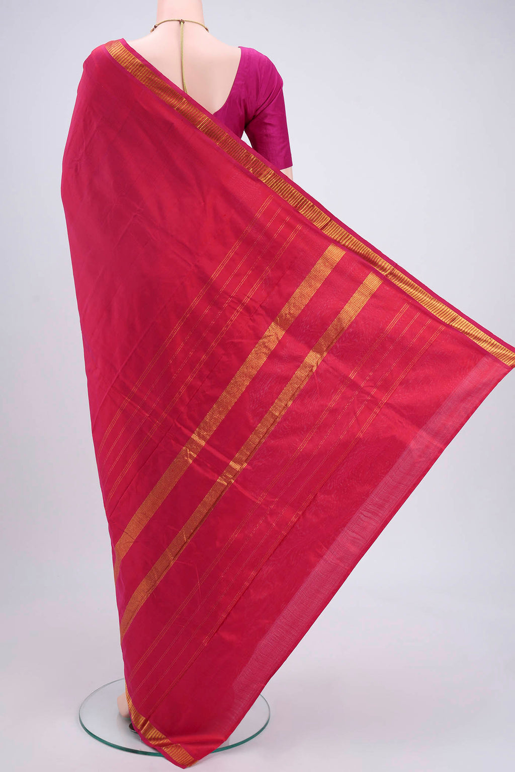 Flat view of Dark Pink Kanchipuram Silk Saree with Plain Body and Zari Border. 
