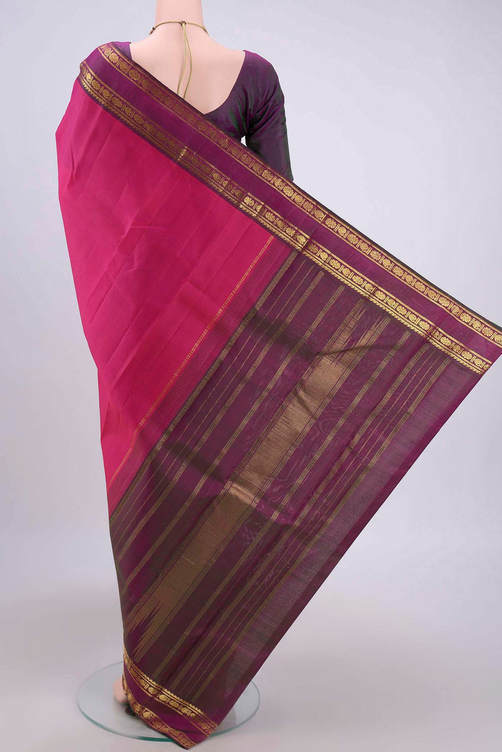 Flat view of Pink Kanchipuram Silk Saree with Stripes on the body and Zari Border. 