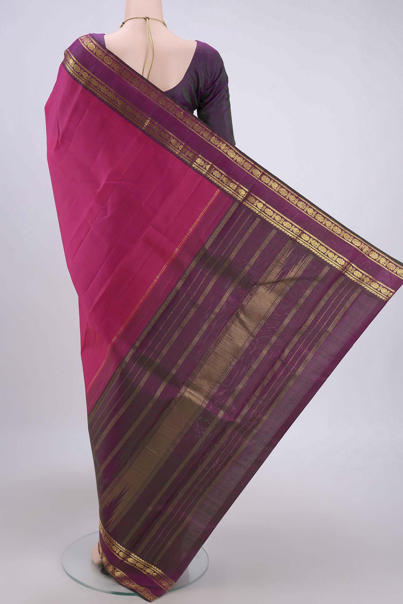 Flat view of Pink Kanchipuram Silk Saree with Stripes on the body and Zari Border. 