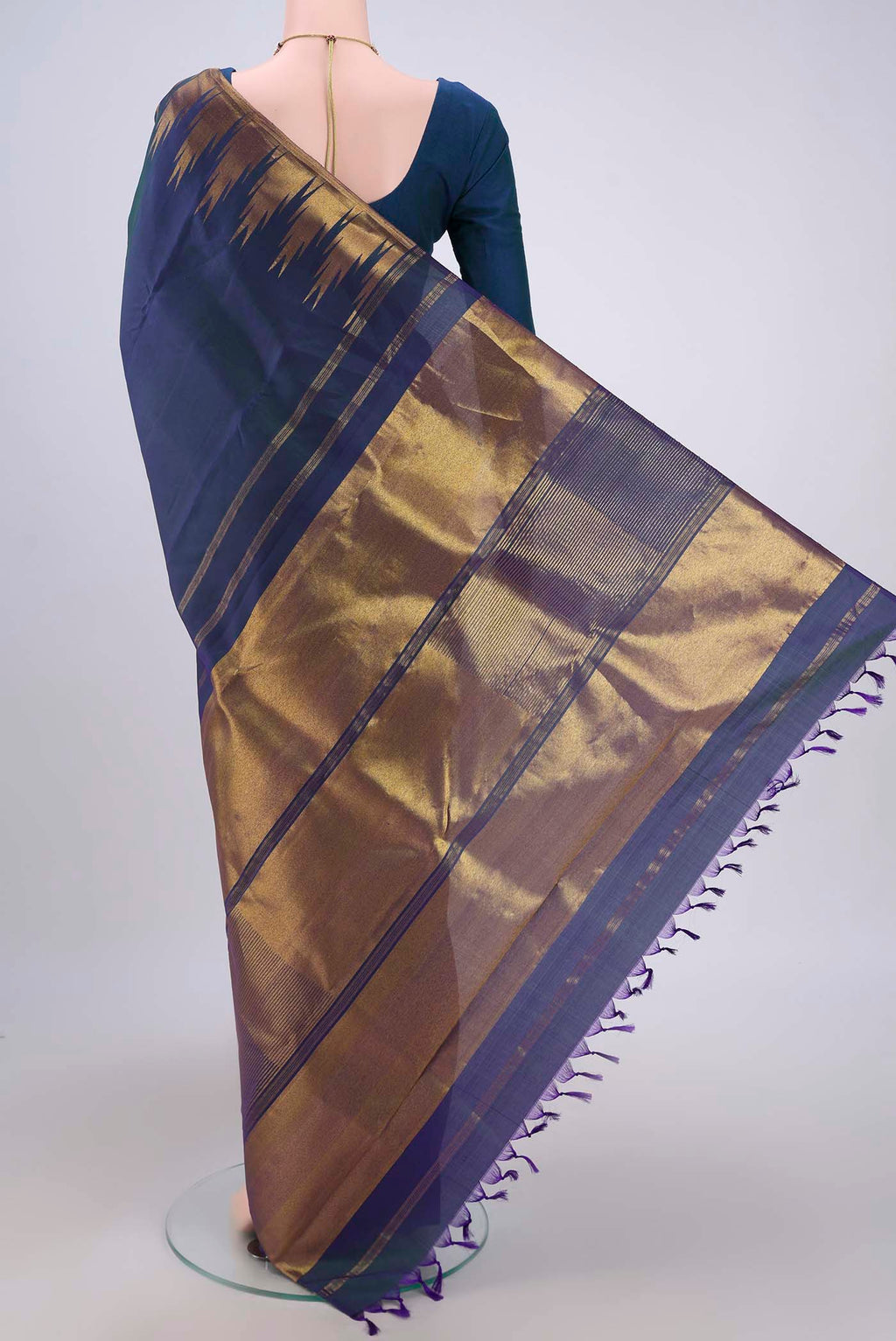 Flat view of Peacock Blue Kanjivaram Silk Saree with Plain Body and Temple Border. 