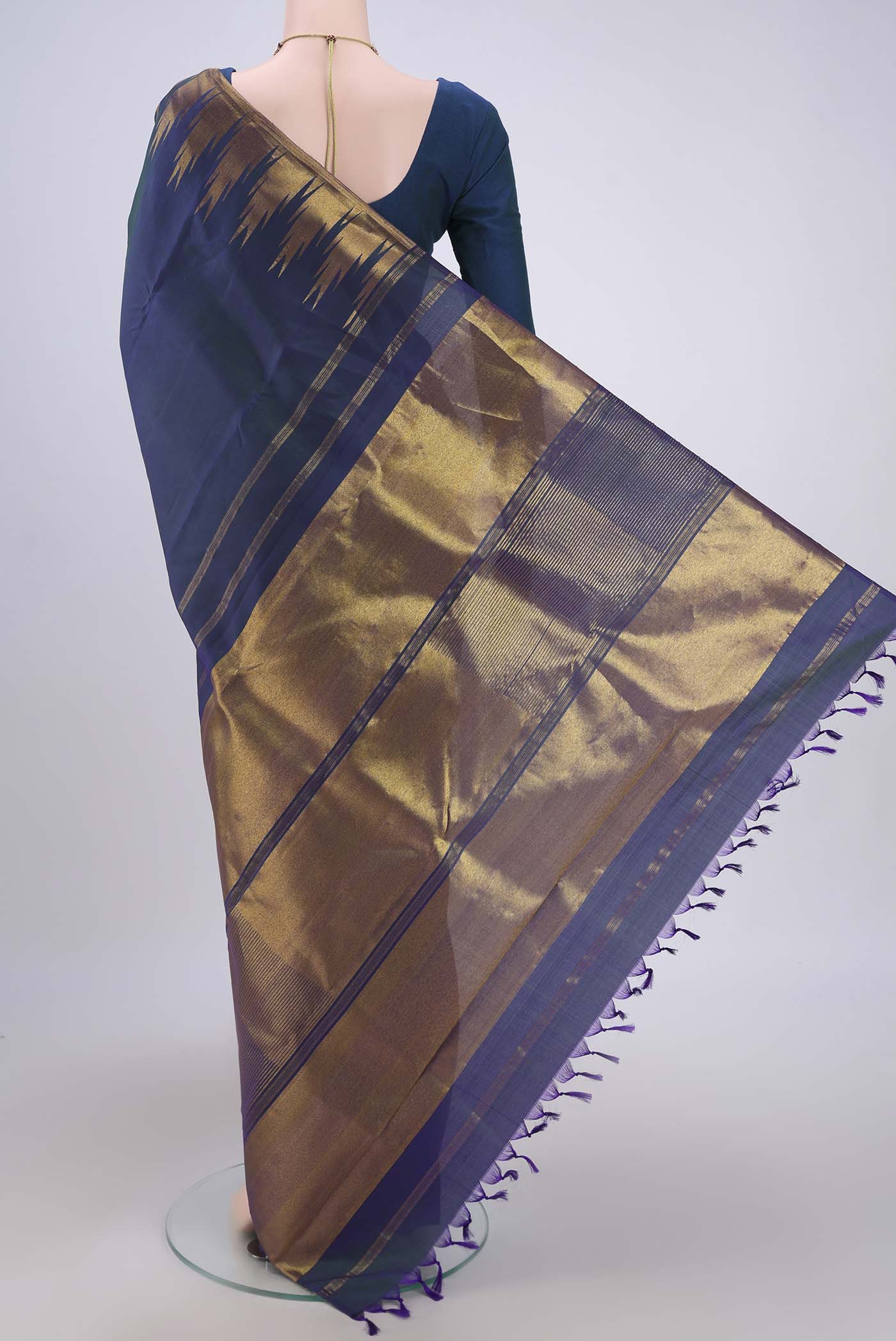 Flat view of Peacock Blue Kanjivaram Silk Saree with Plain Body and Temple Border. 