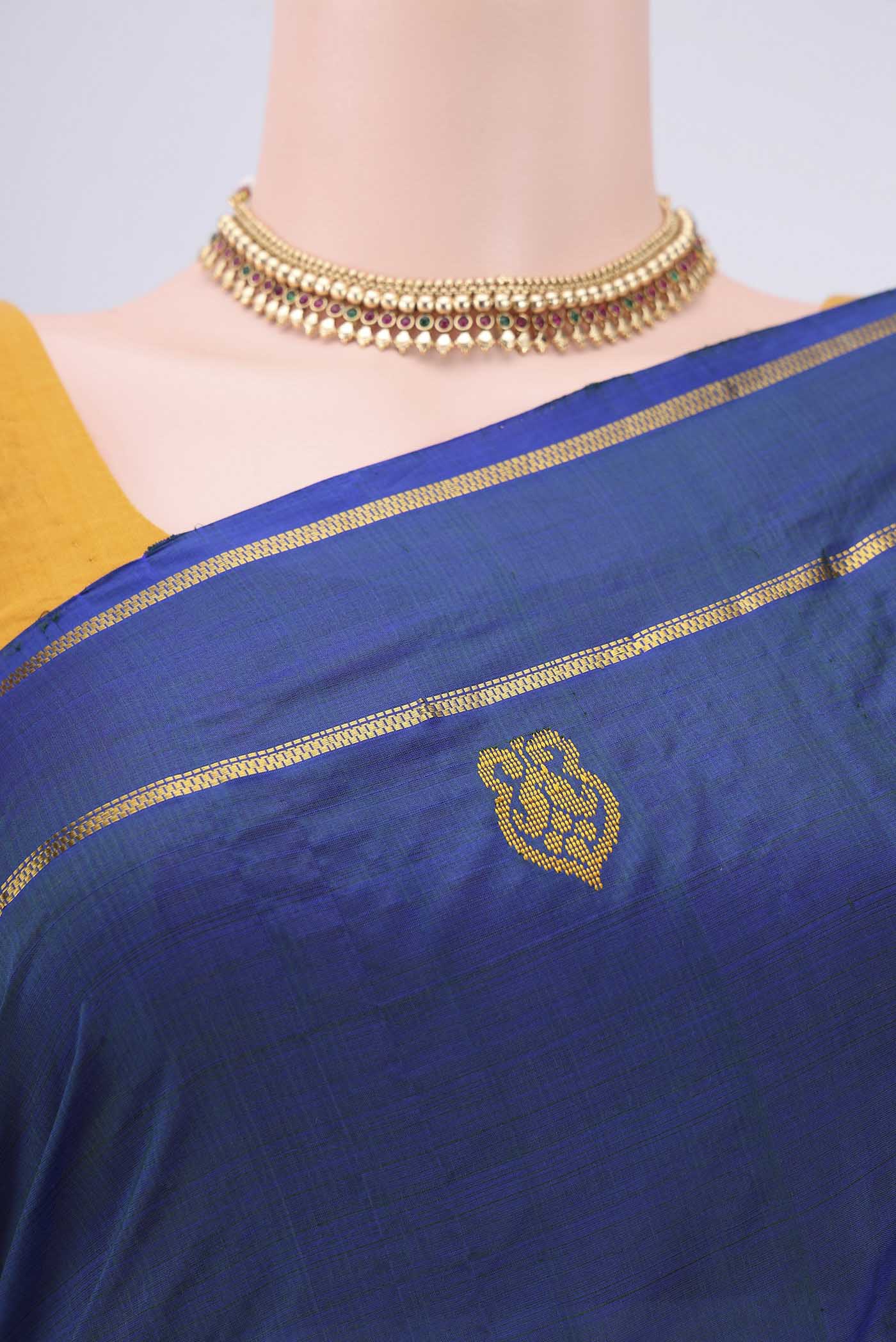 Border image of Blue Kanchipuram Silk Saree with Plain Body and Zari And Thread Border. 