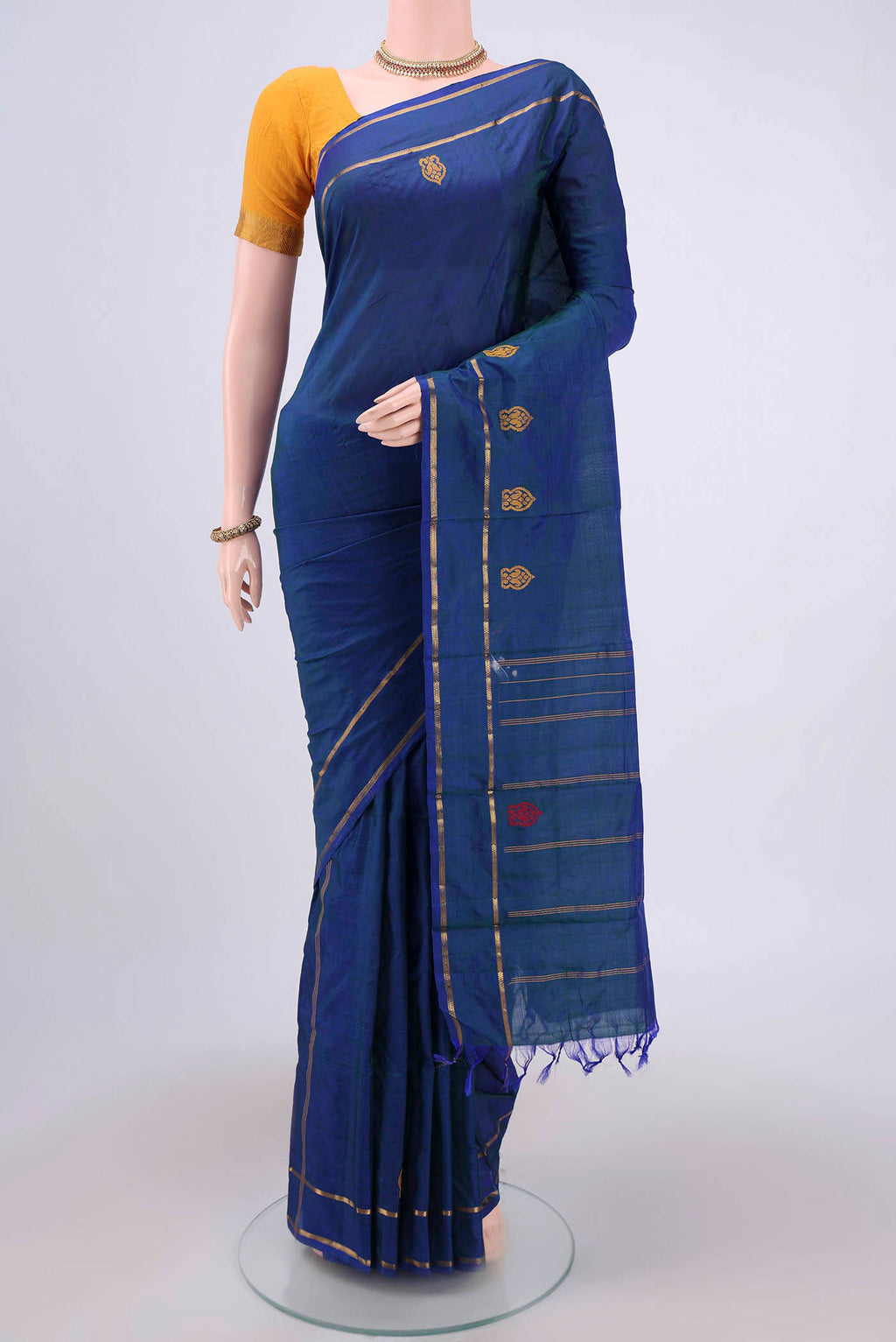 Blue Kanchipuram Silk Saree with Plain Body and Zari And Thread Border.  displayed on a mannequin