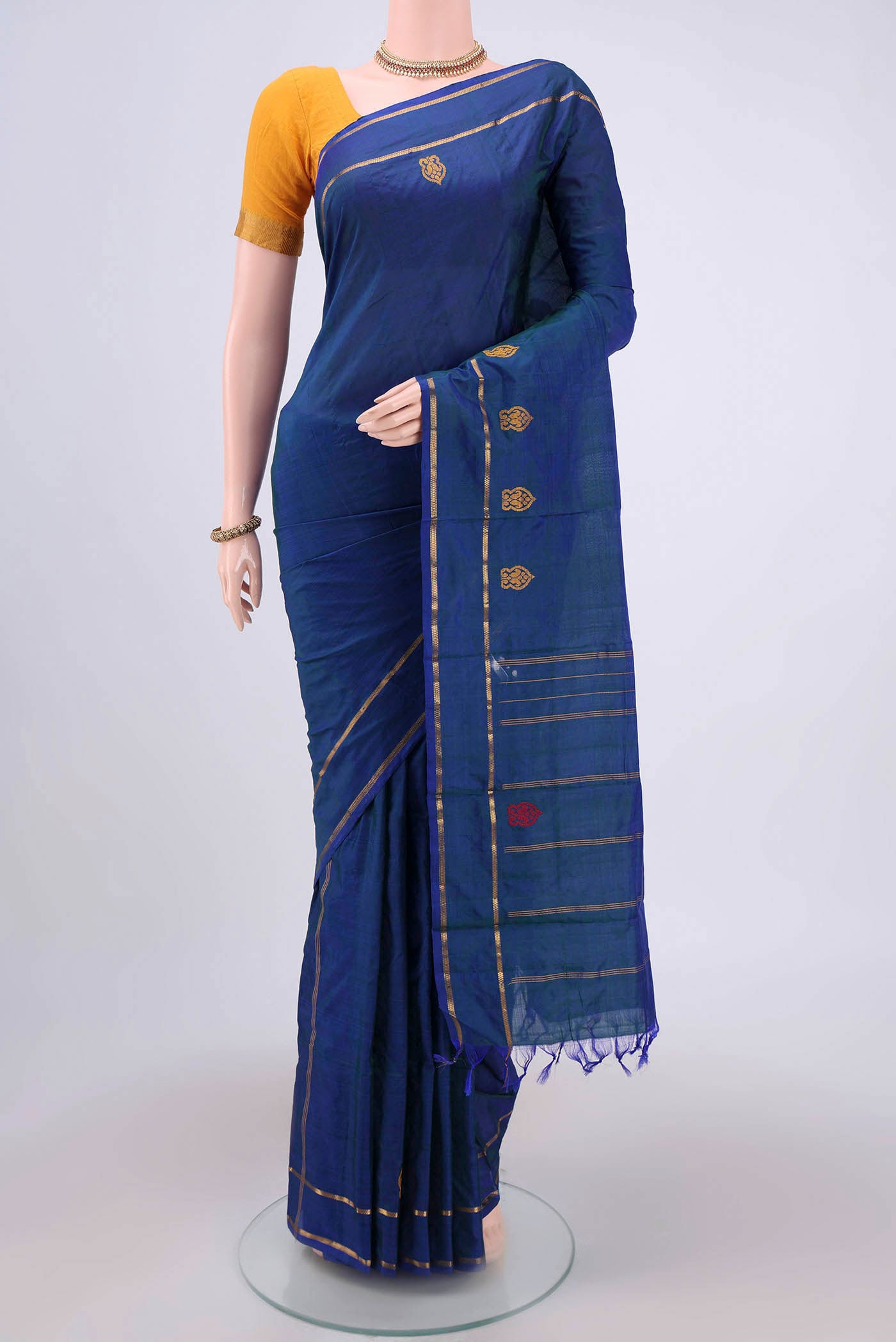 Blue Kanchipuram Silk Saree with Plain Body and Zari And Thread Border.  displayed on a mannequin