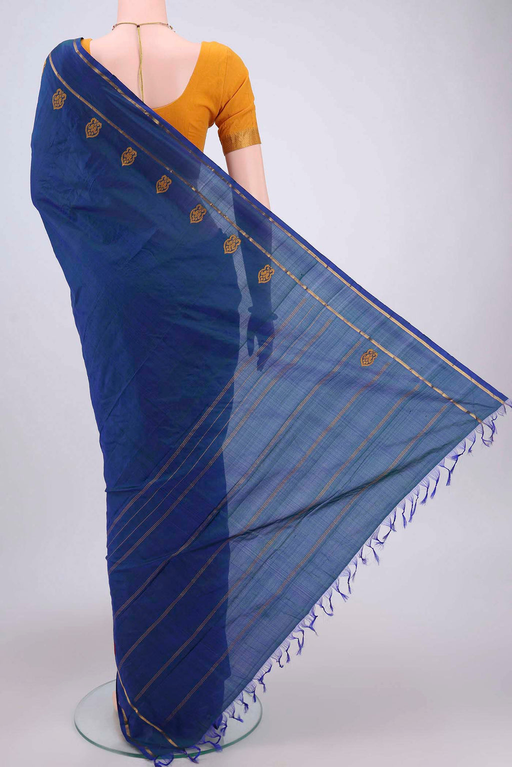 Flat view of Blue Kanchipuram Silk Saree with Plain Body and Zari And Thread Border. 