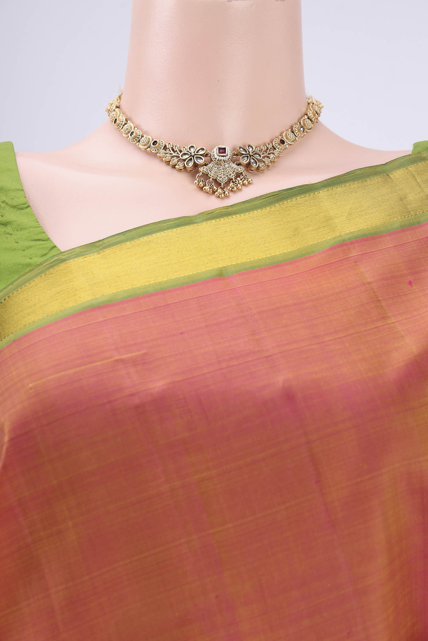 Border image of Brick Orange Dual Tone Kanjivaram Silk Saree with Plain Body and Zari Border. 