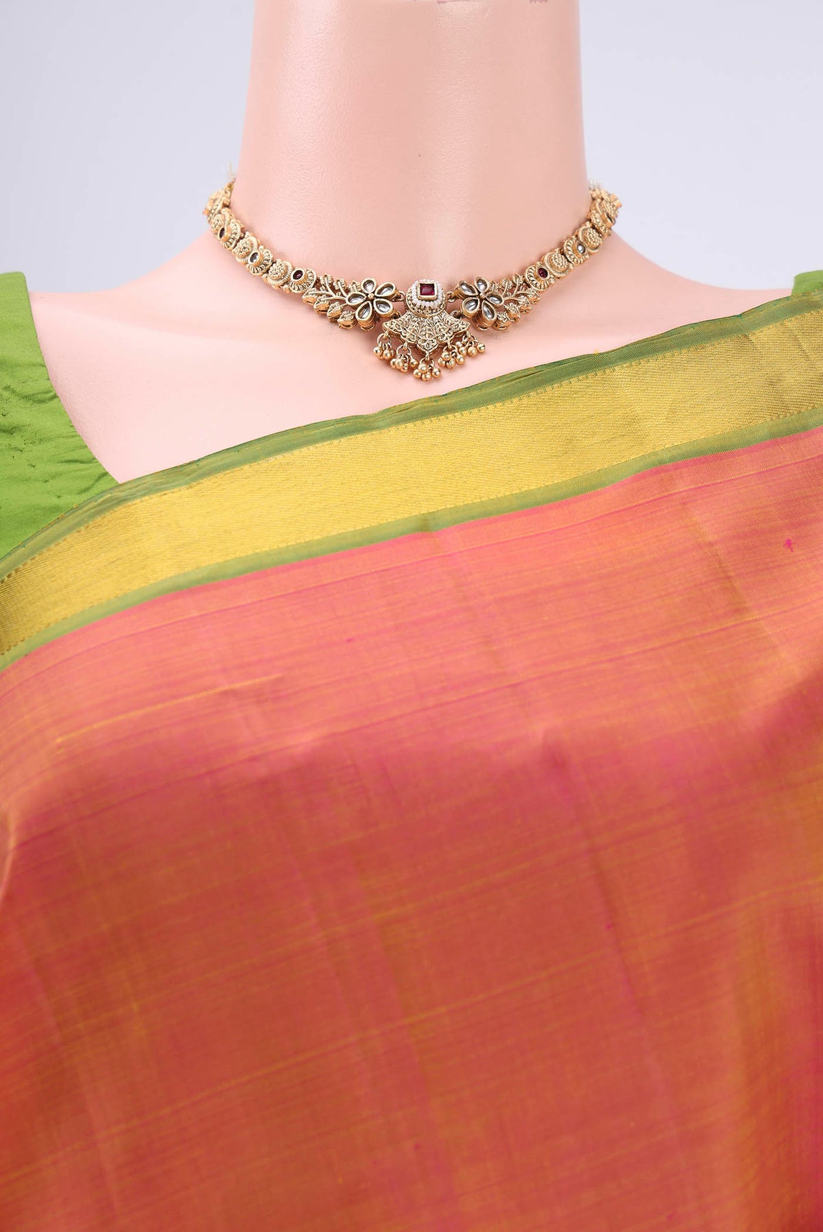 Border image of Brick Orange Dual Tone Kanjivaram Silk Saree with Plain Body and Zari Border. 