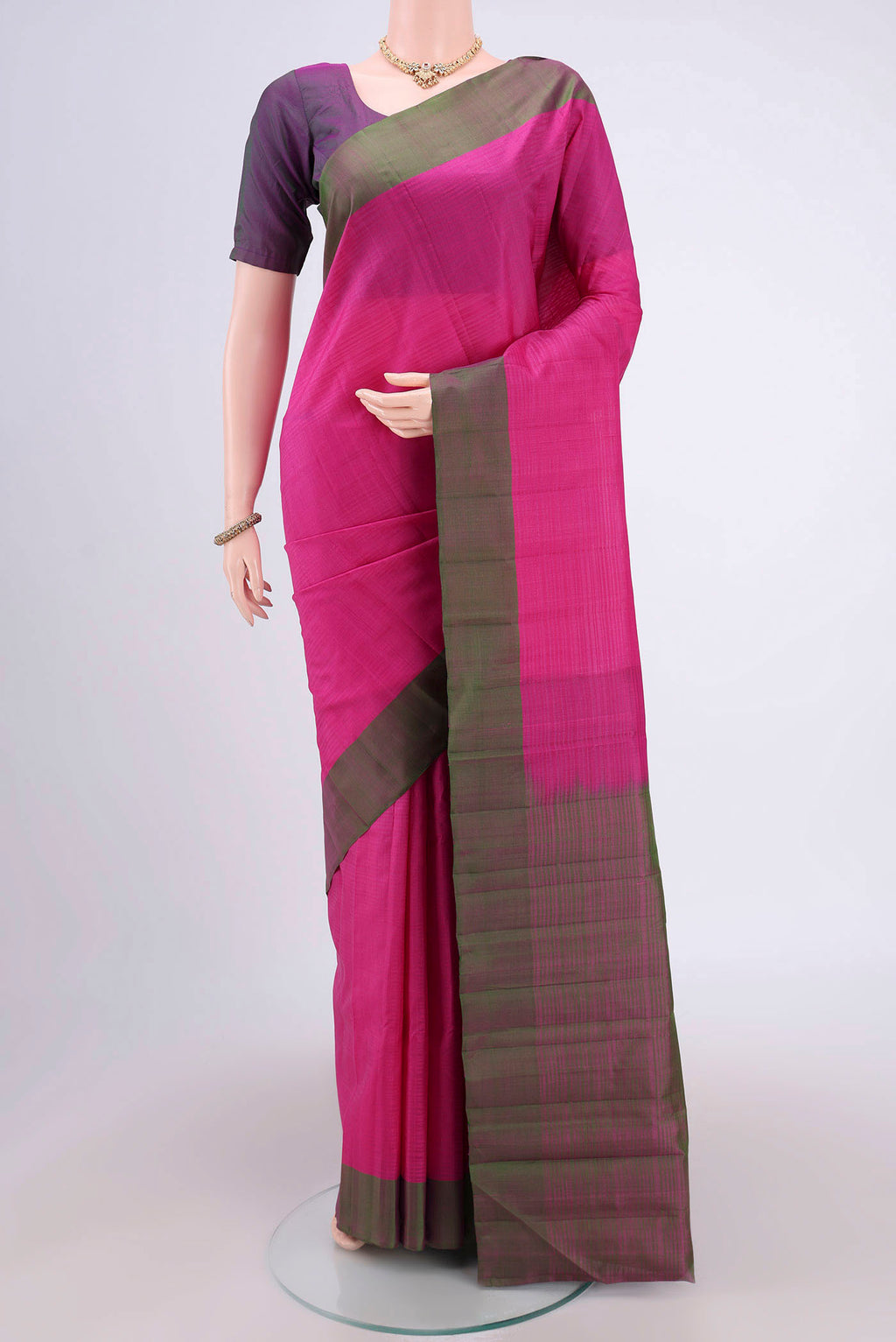 Rani Pink Kanjivaram Silk Saree with Plain Body and Plain Border.  displayed on a mannequin
