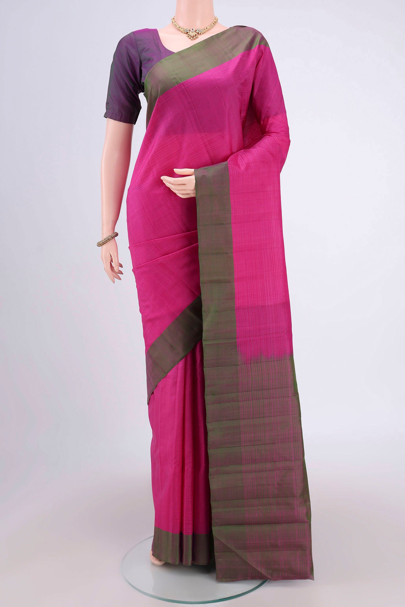 Rani Pink Kanjivaram Silk Saree with Plain Body and Plain Border.  displayed on a mannequin