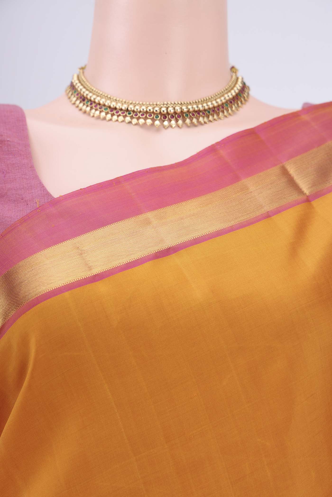 Border image of Mustard Kanjivaram Silk Saree with Plain Body and Zari Border. 