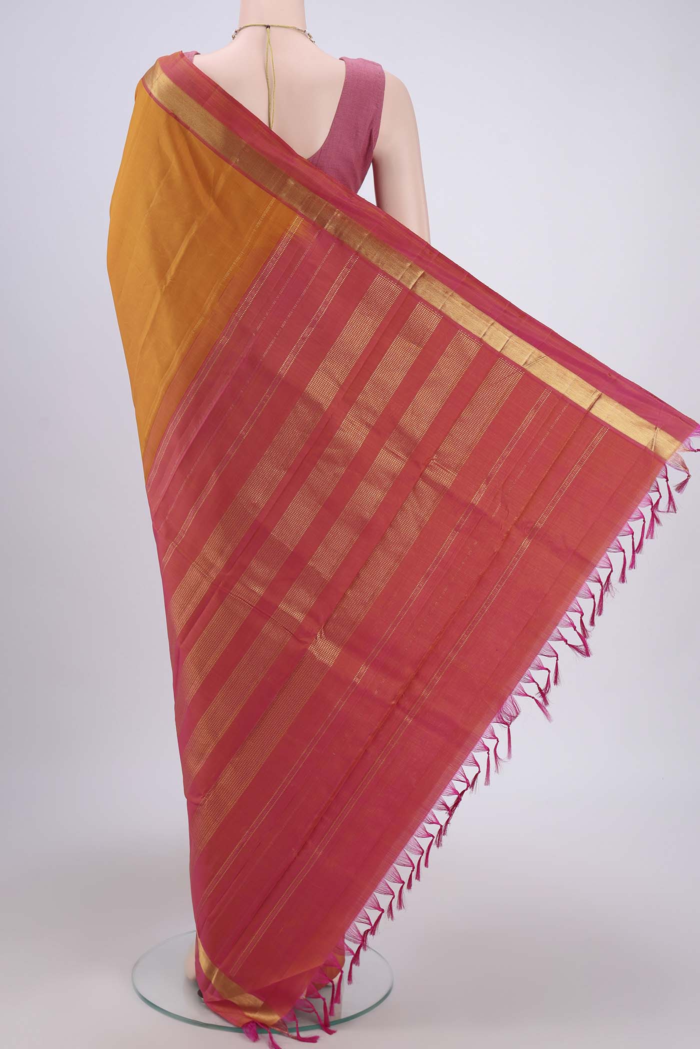 Flat view of Mustard Kanjivaram Silk Saree with Plain Body and Zari Border. 