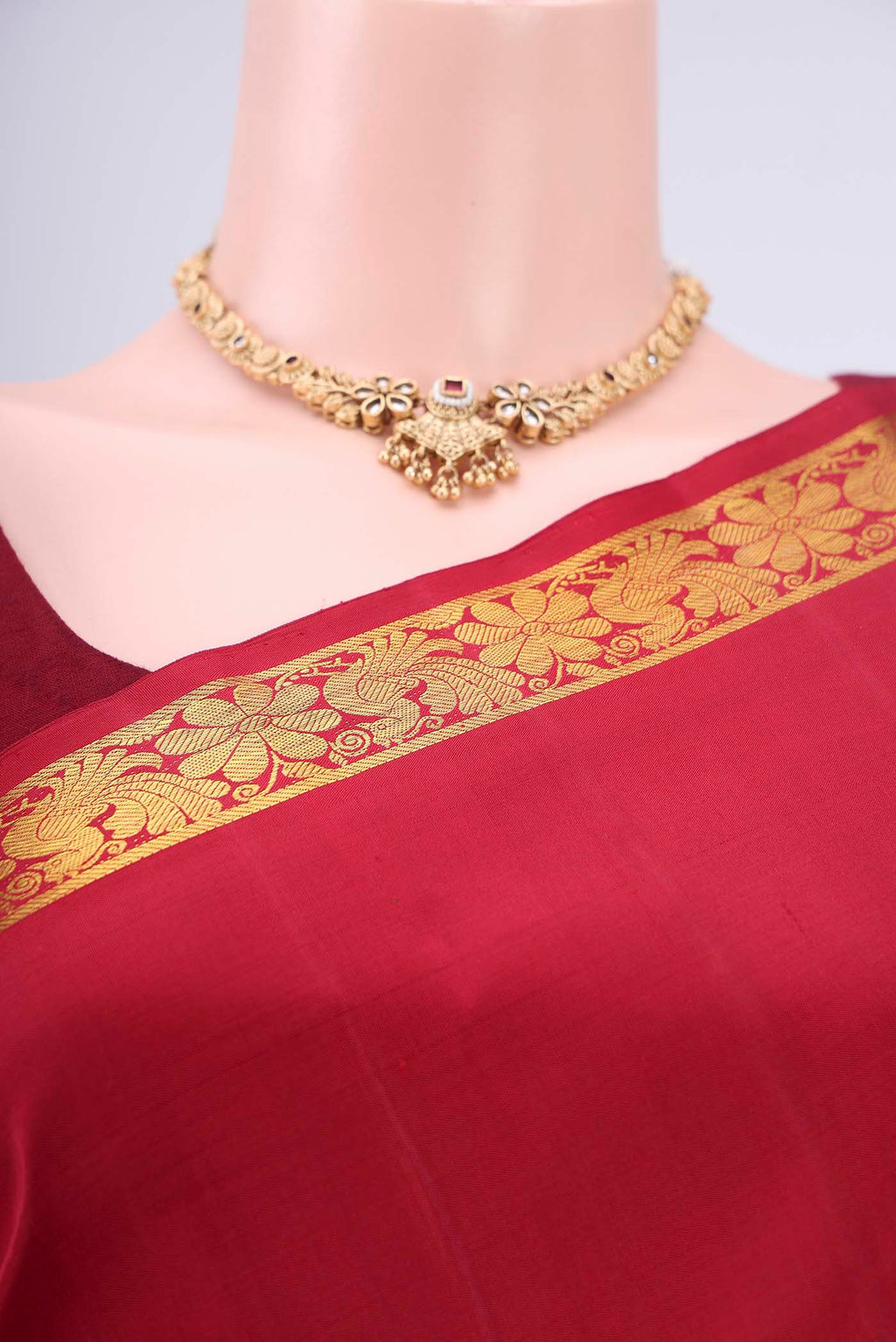 Border image of Maroon Dual Tone Kanjivaram Silk Saree with Plain Body and Zari And Thread Border. 