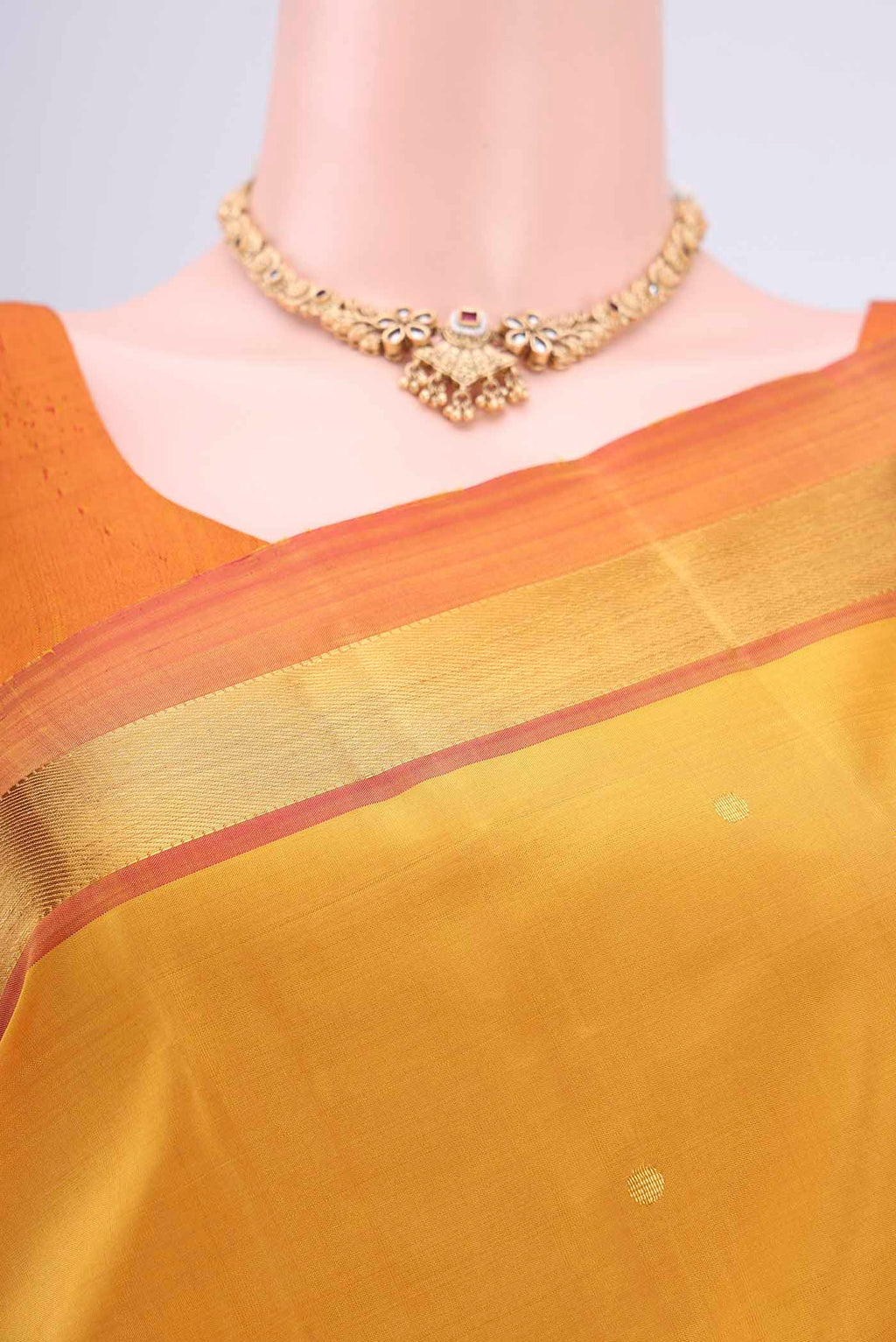 Border image of Mustard Dual Tone Kanjivaram Silk Saree with Zari Butta on the body and Zari Border. 