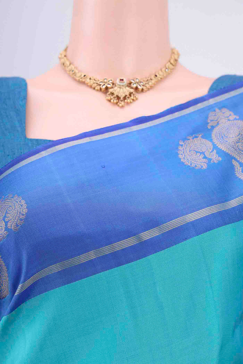 Border image of Turquoise Kanchipuram Silk Saree with Plain Body and Zari Border. 